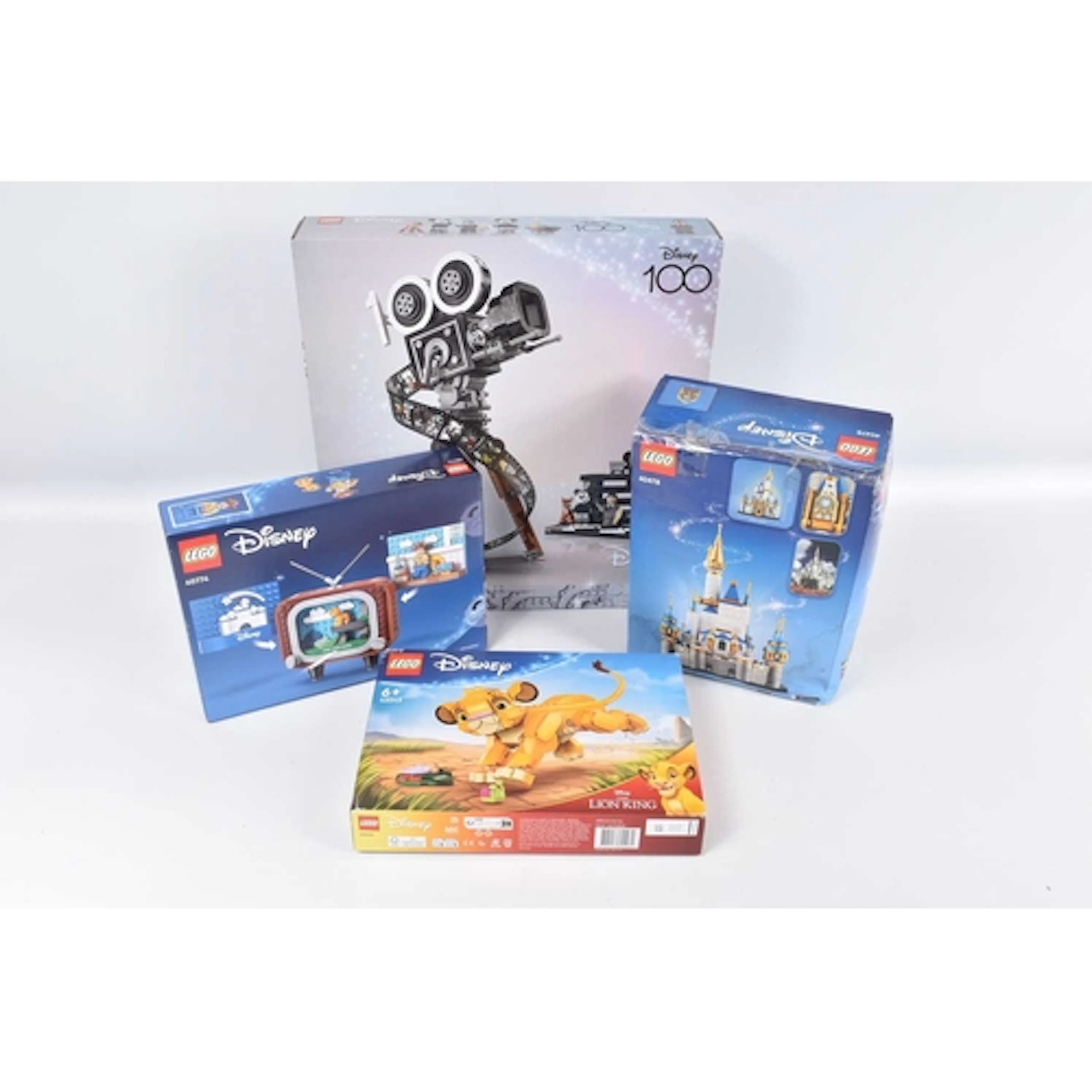 FOUR BOXED DISNEY LEGO SETS, to include a Lego Disney 100 Wa...