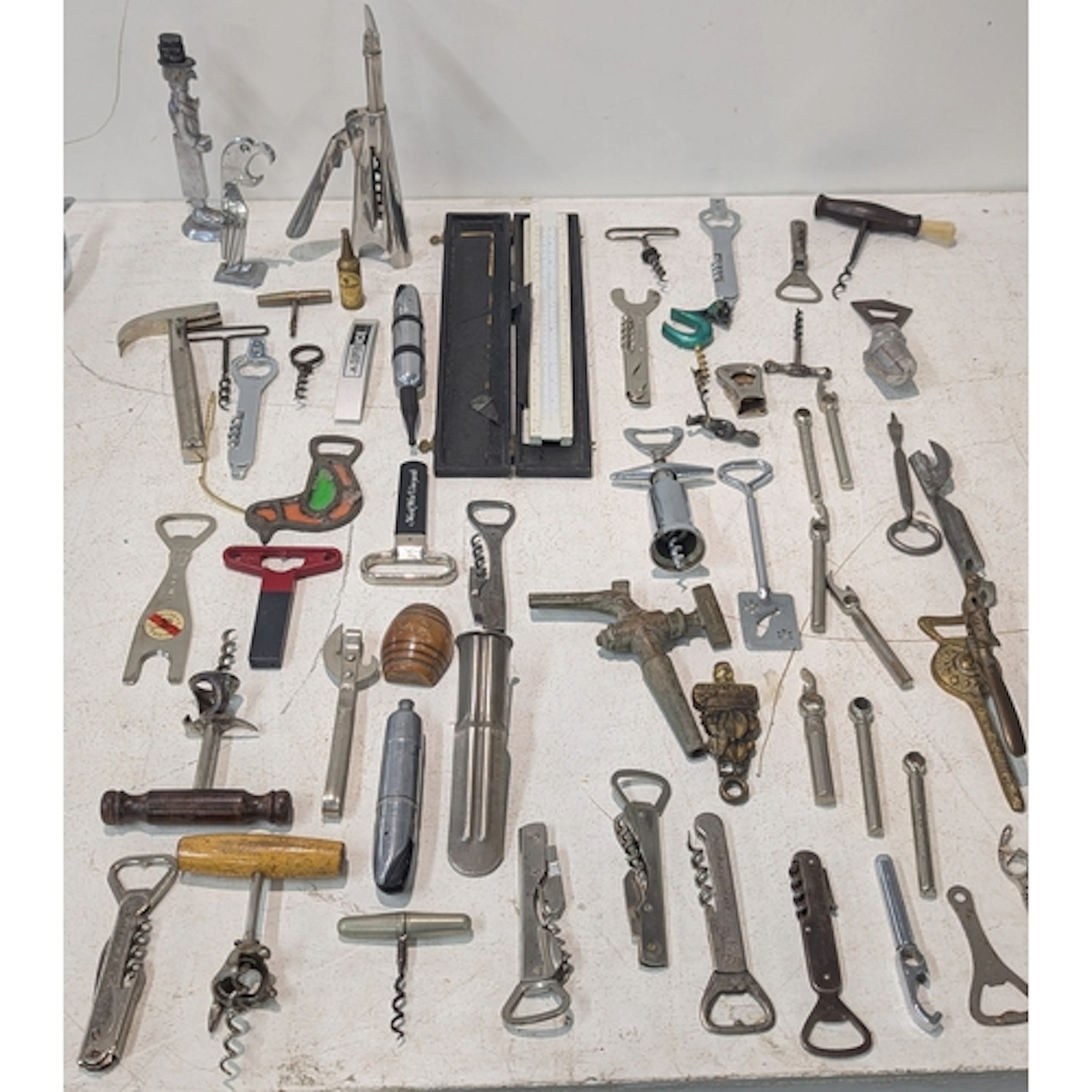 A collection of vintage corkscrews and bottle openers to inc...