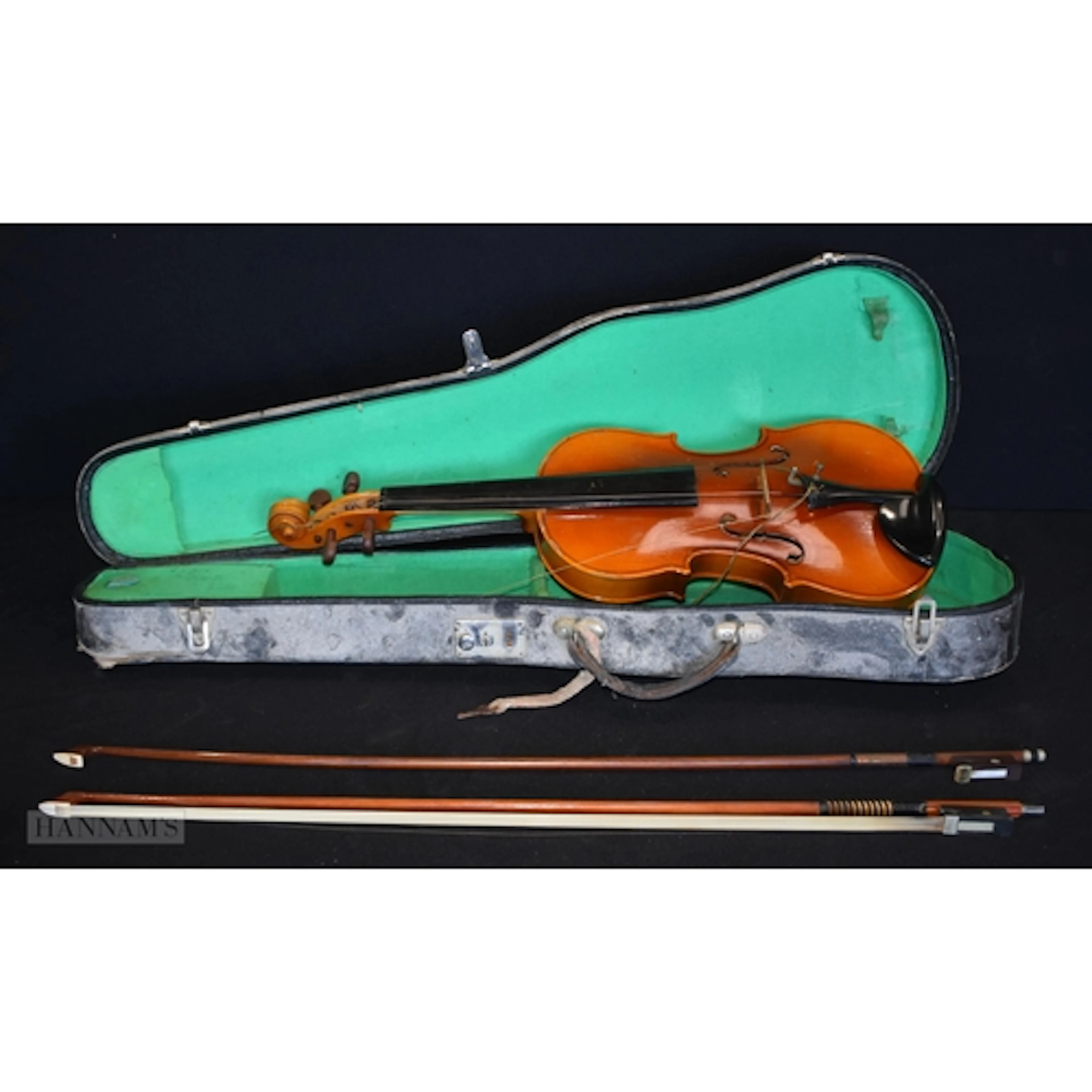 A cased violin with two bows 56cm