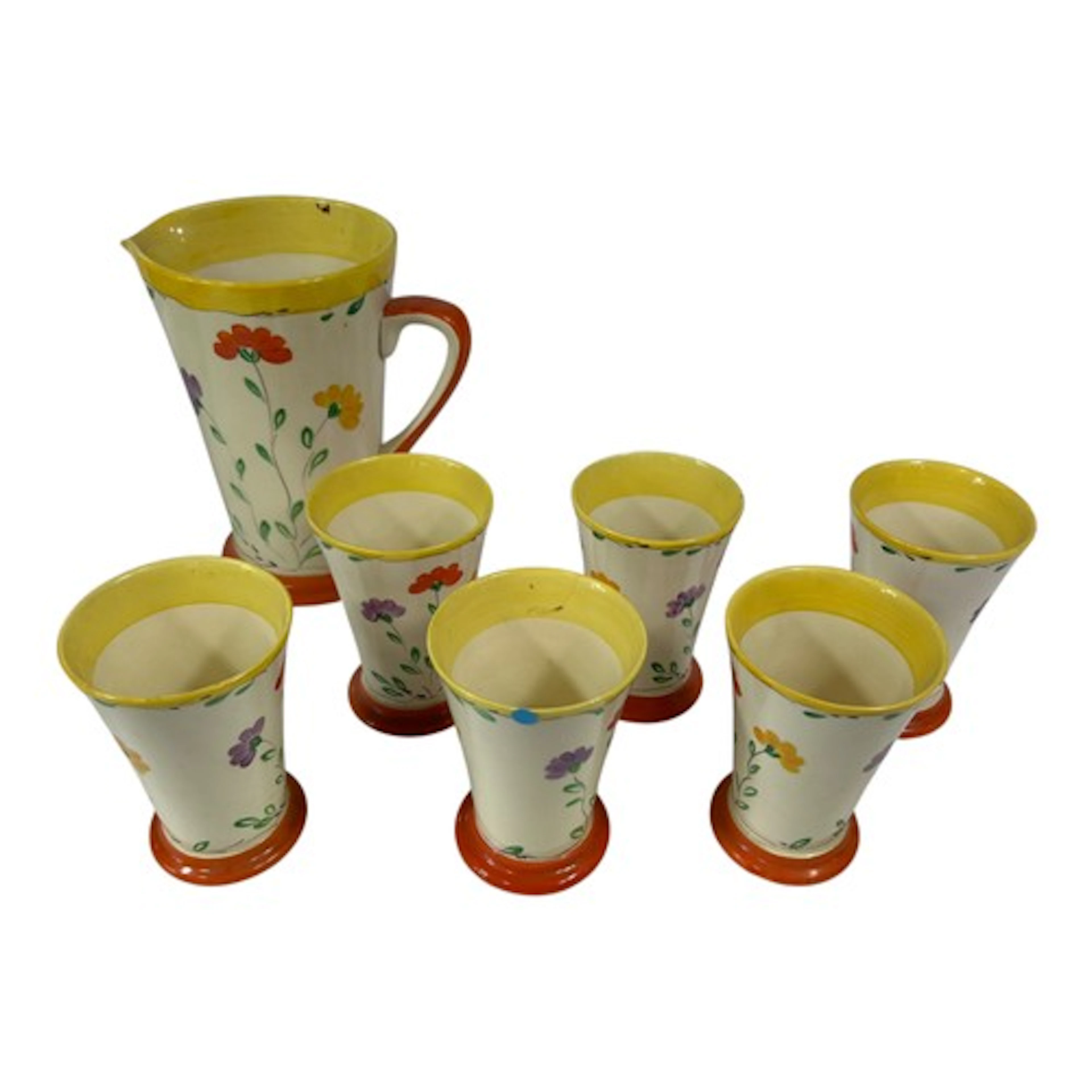 In the style of Clarice Cliff, a brightly coloured 1930’s ce...