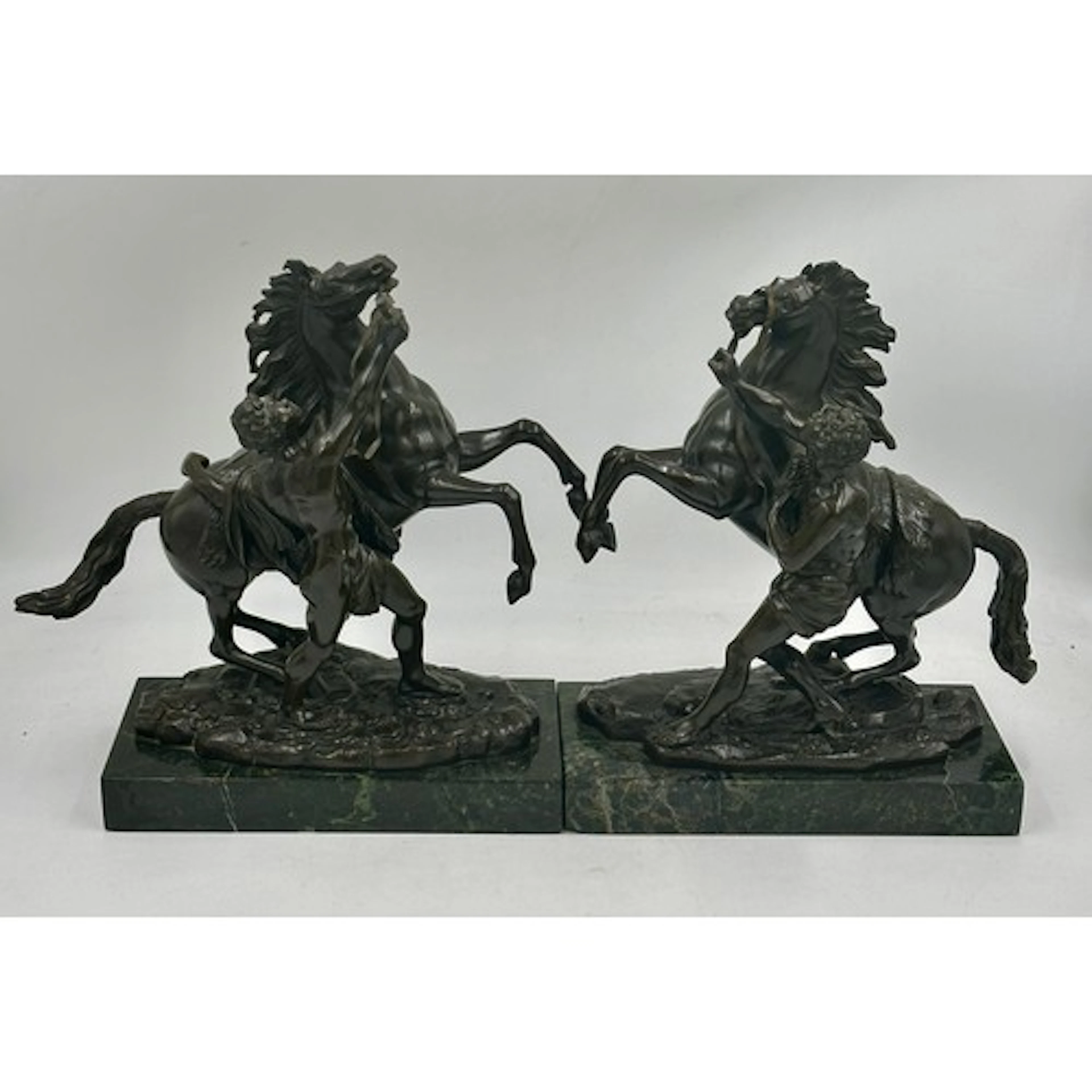 After Guillaume Coustou I (1677 - 1746) A pair of 19thC dark...