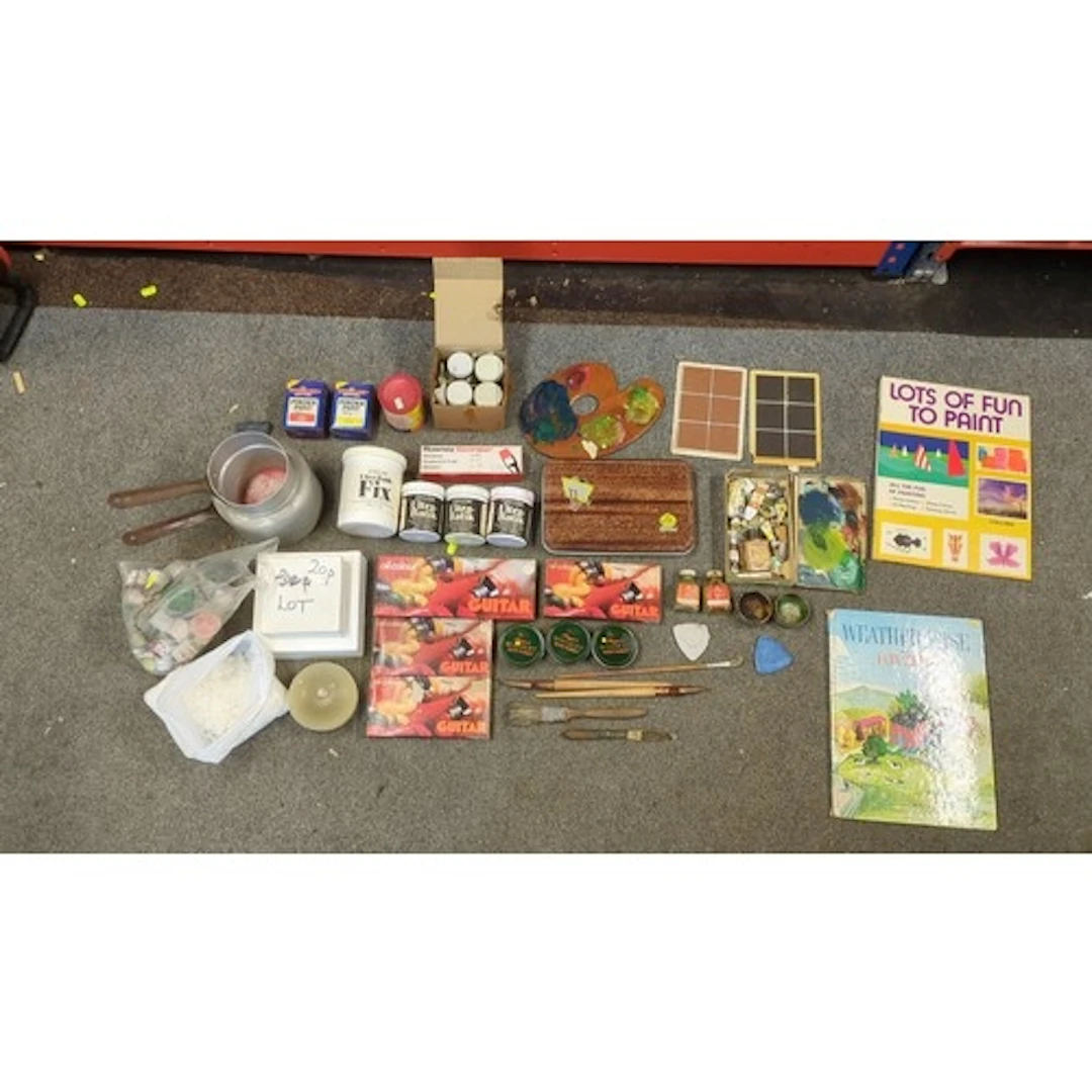 An assortment of artists’ materials including boxed oil colo...