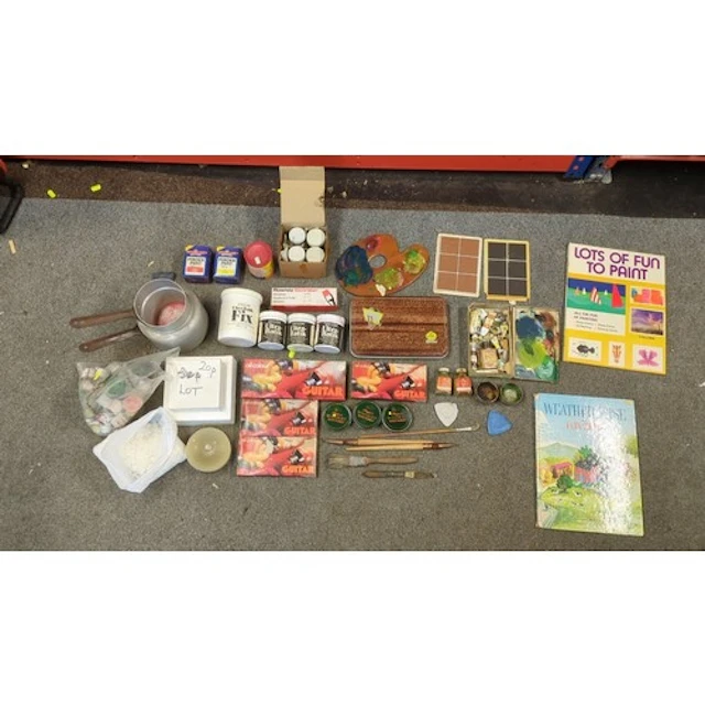 An assortment of artists’ materials including boxed oil colo...