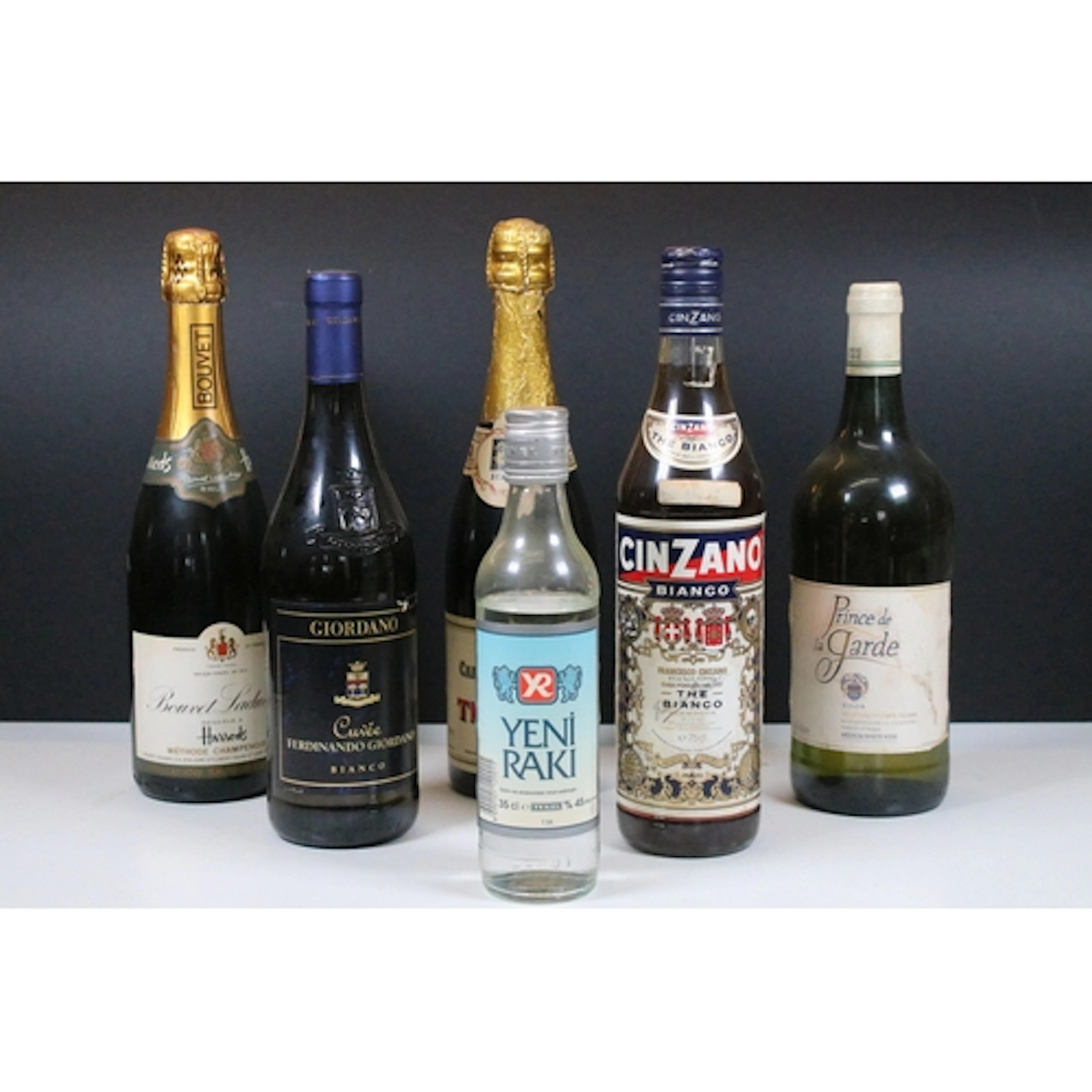 Collection of six bottles of wines and spirits, to comprise ...