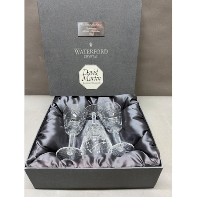 A box set of Three Water Crysal cut glass wine glasses....