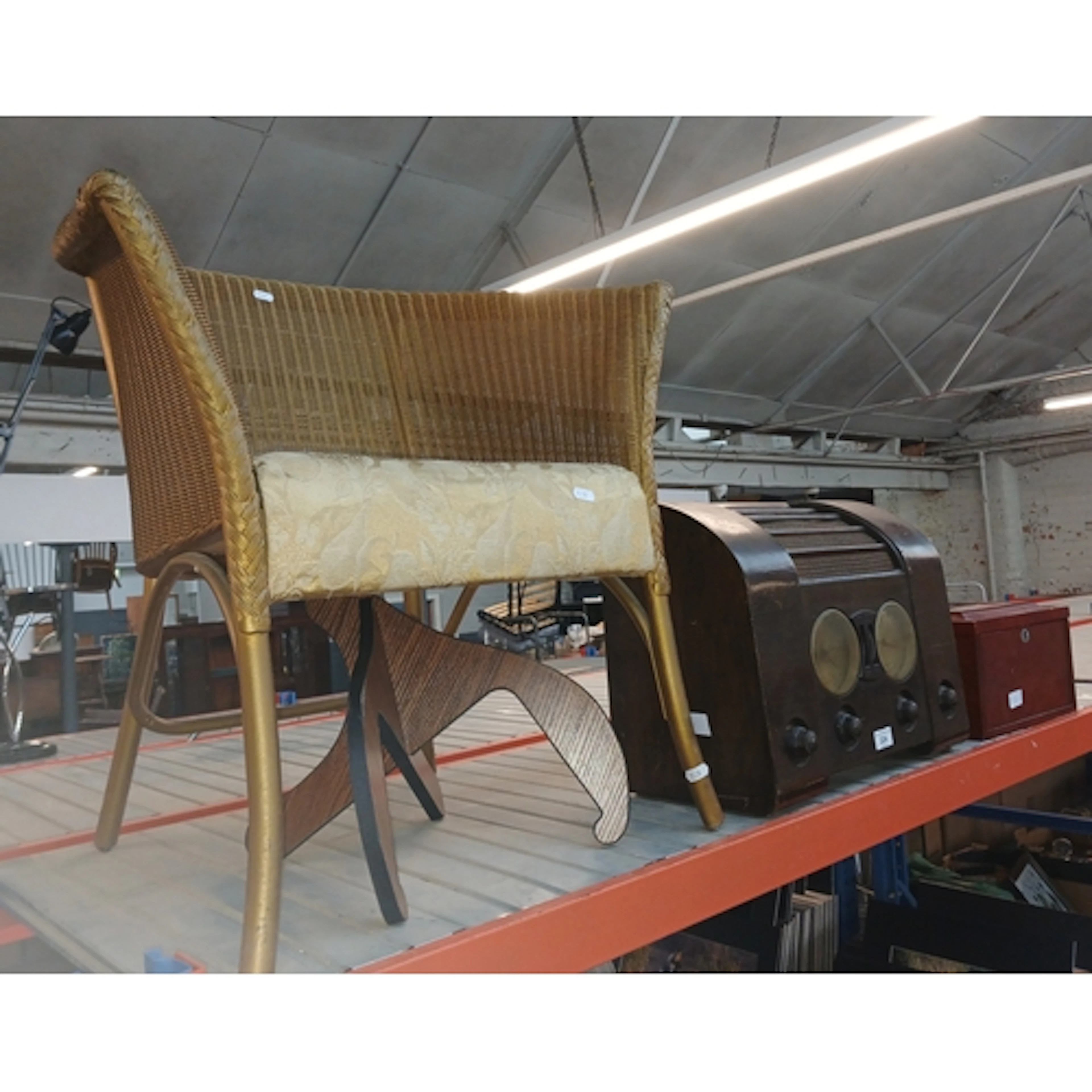 A Lloyd Loom chair, a vintage Goblin electric radio alarm, a...