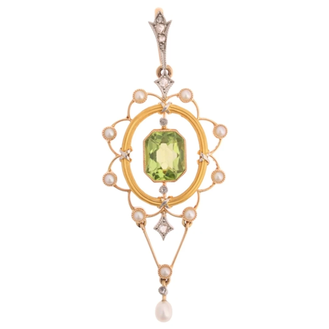 An Edwardian gold peridot diamond and pearl openwork pendant...