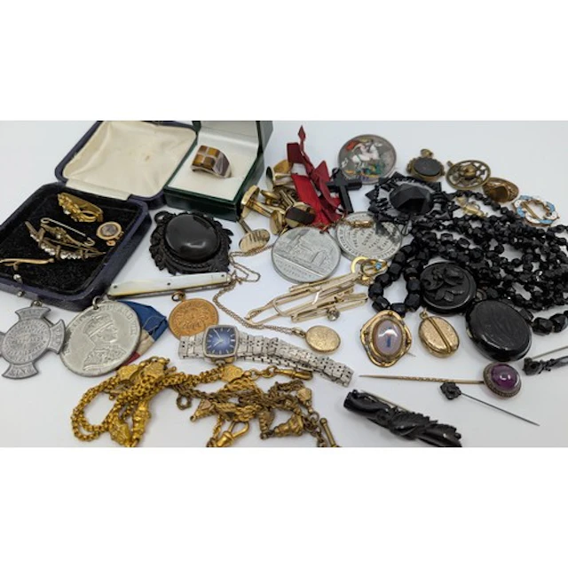 A selection of silver, jet and costume jewellery; the silver...