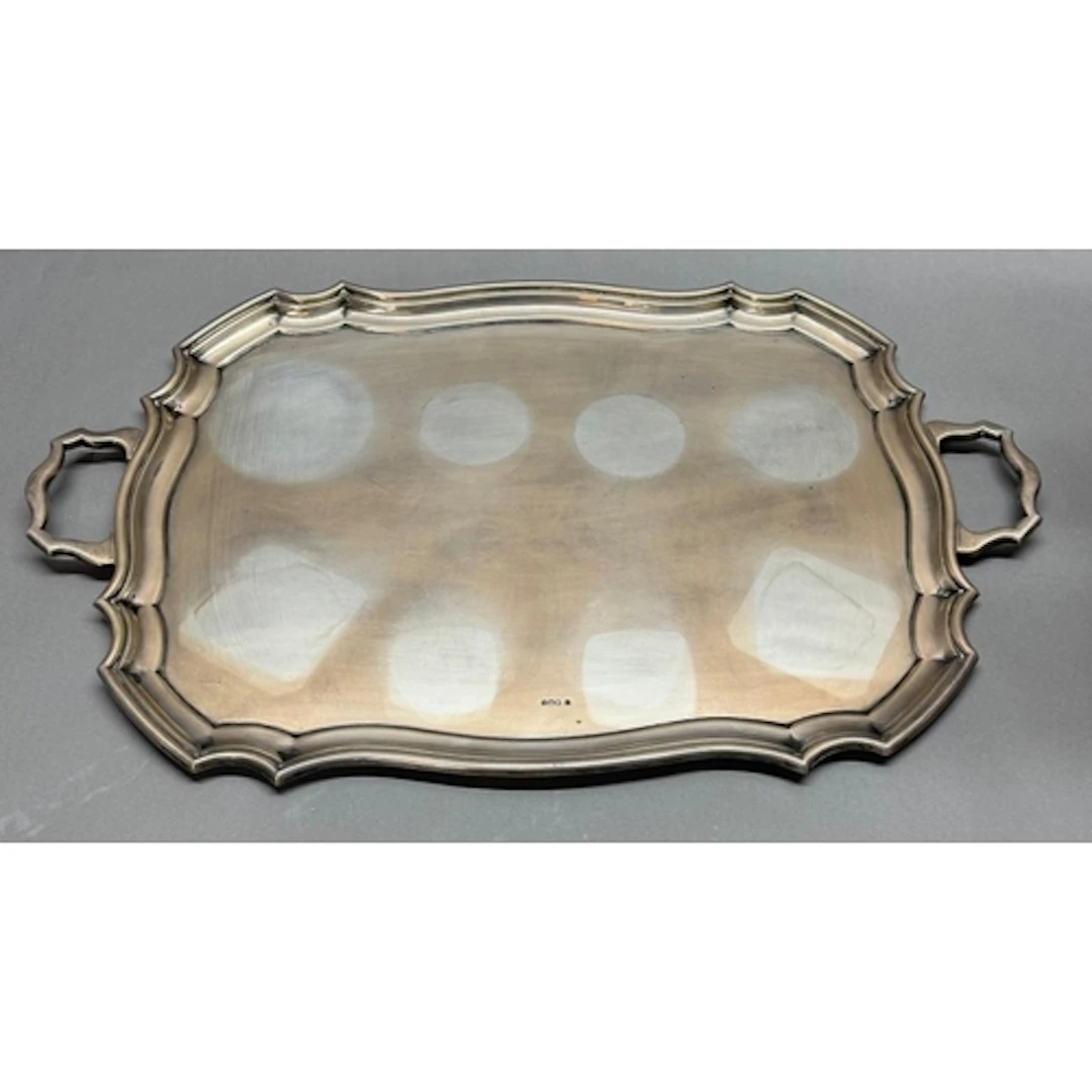 A two handled silver tray, hallmarked for Sheffield 1921 by ...