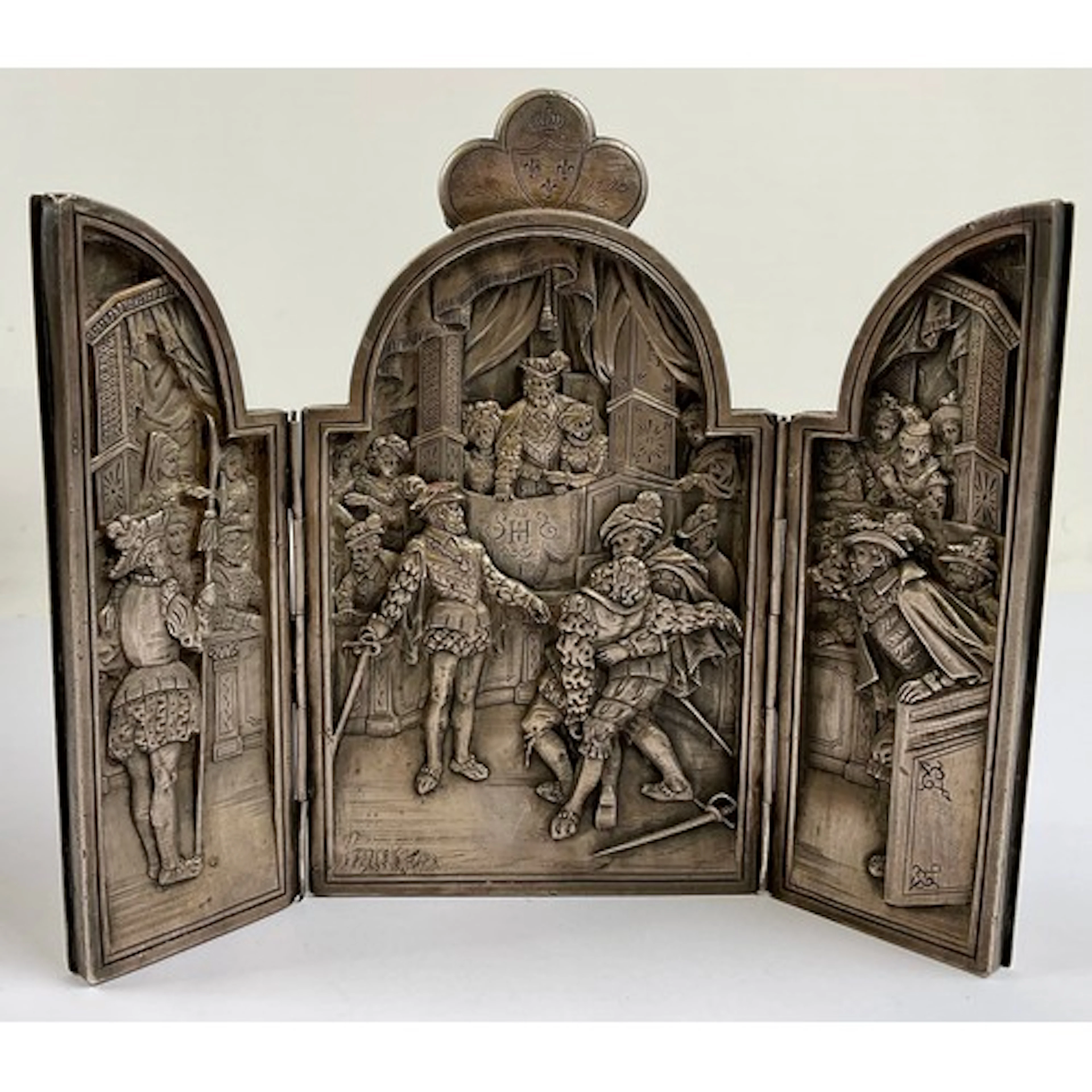 A 16th century Revival white metal easel triptych, cast in r...
