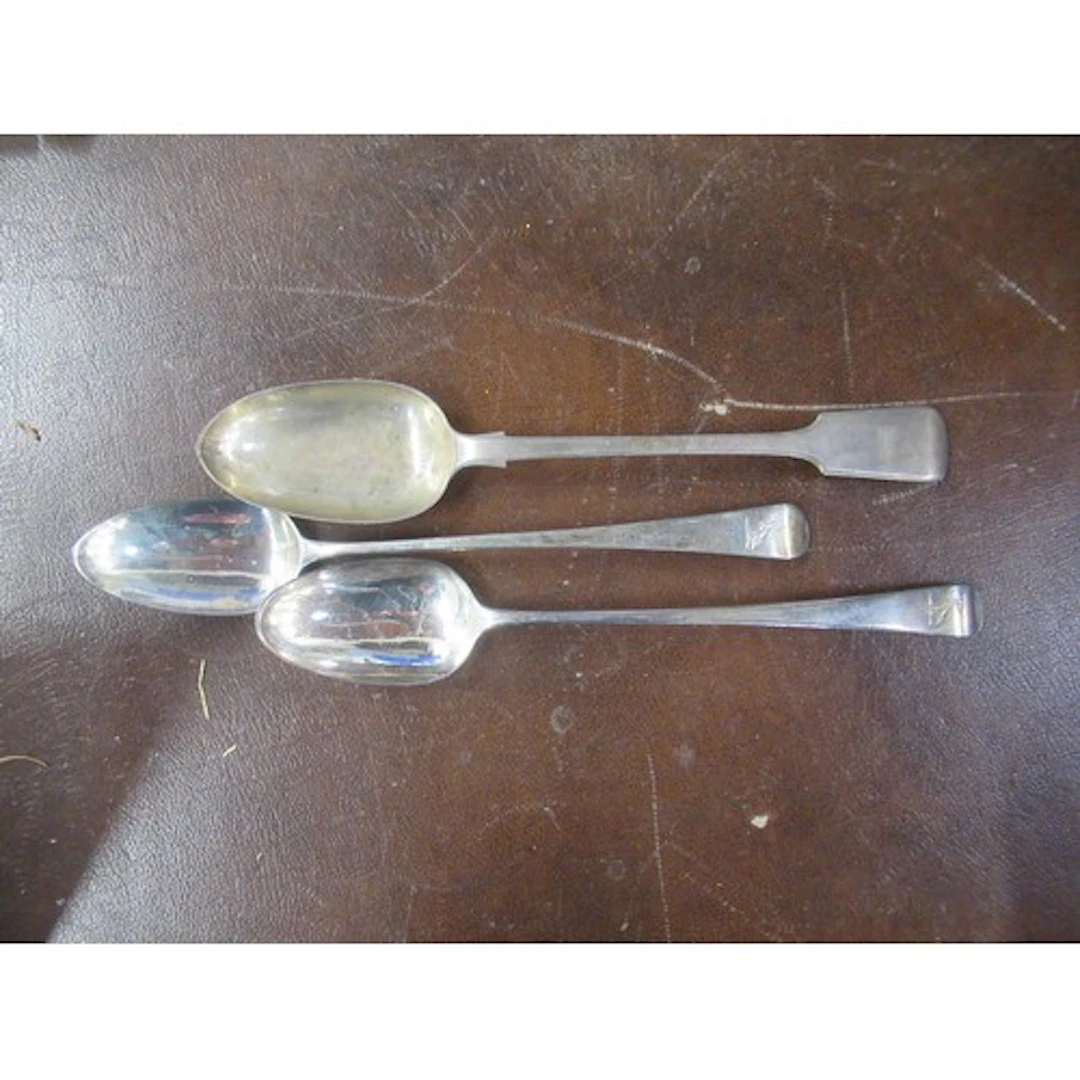 Three 19th century silver basting spoons, all engraved with ...