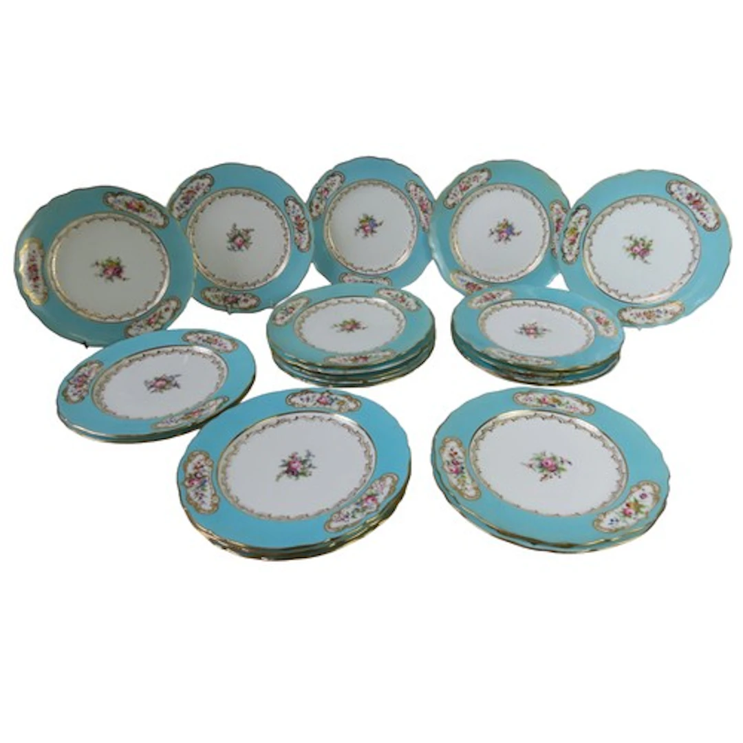 A SET OF CONTINENTAL SEVRES STYLE PLATES, the blue borders w...