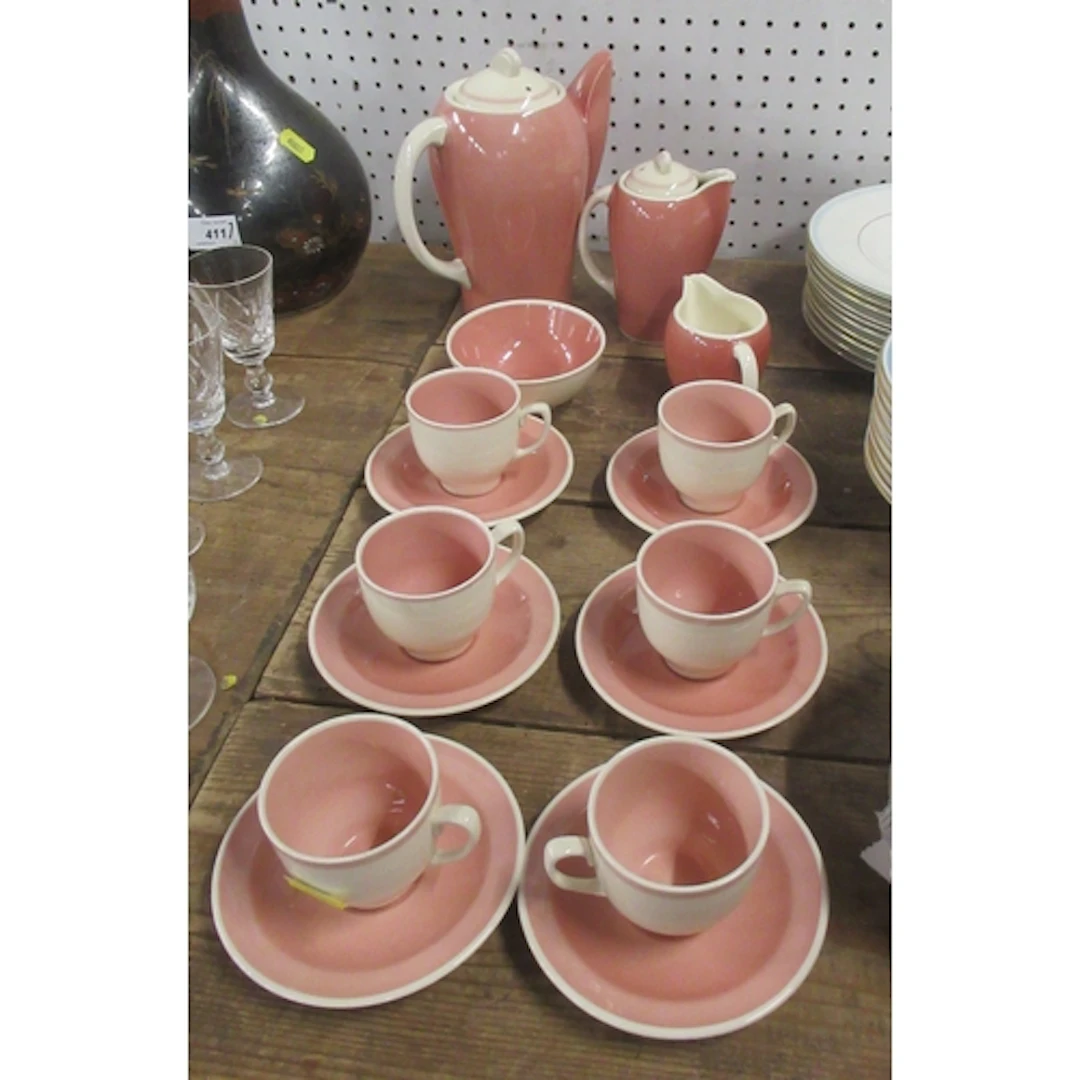 A Susie Cooper coffee set, numbered 2055