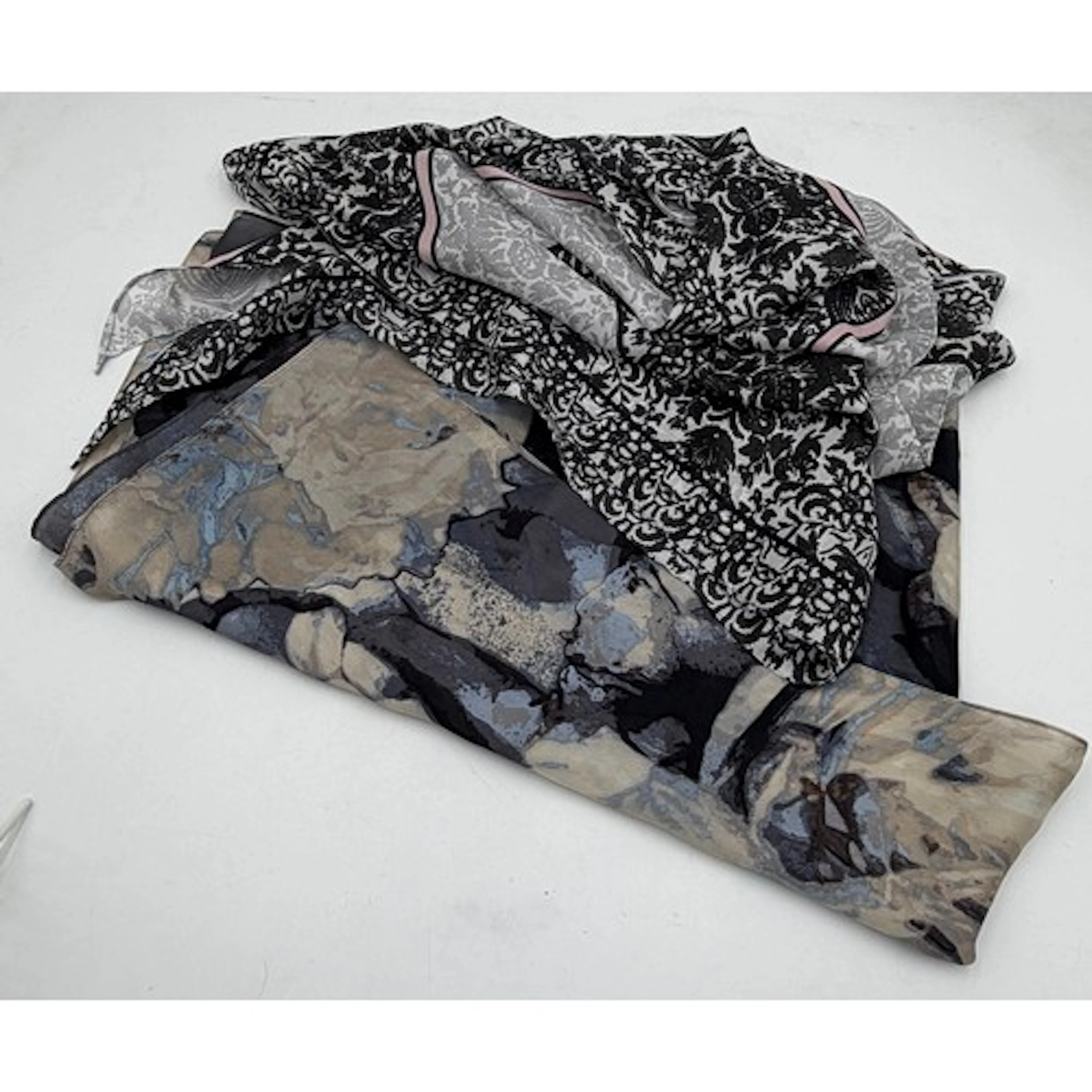 Two scarves by Vince Camuto to include a silk scarf in tones...