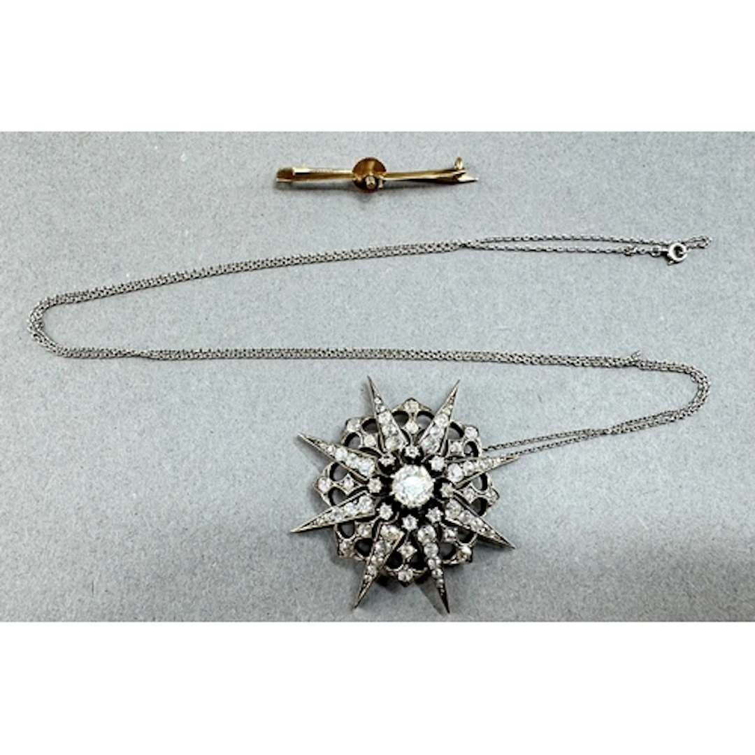 Jewellery: a late 19th century diamond starburst pendant bro...