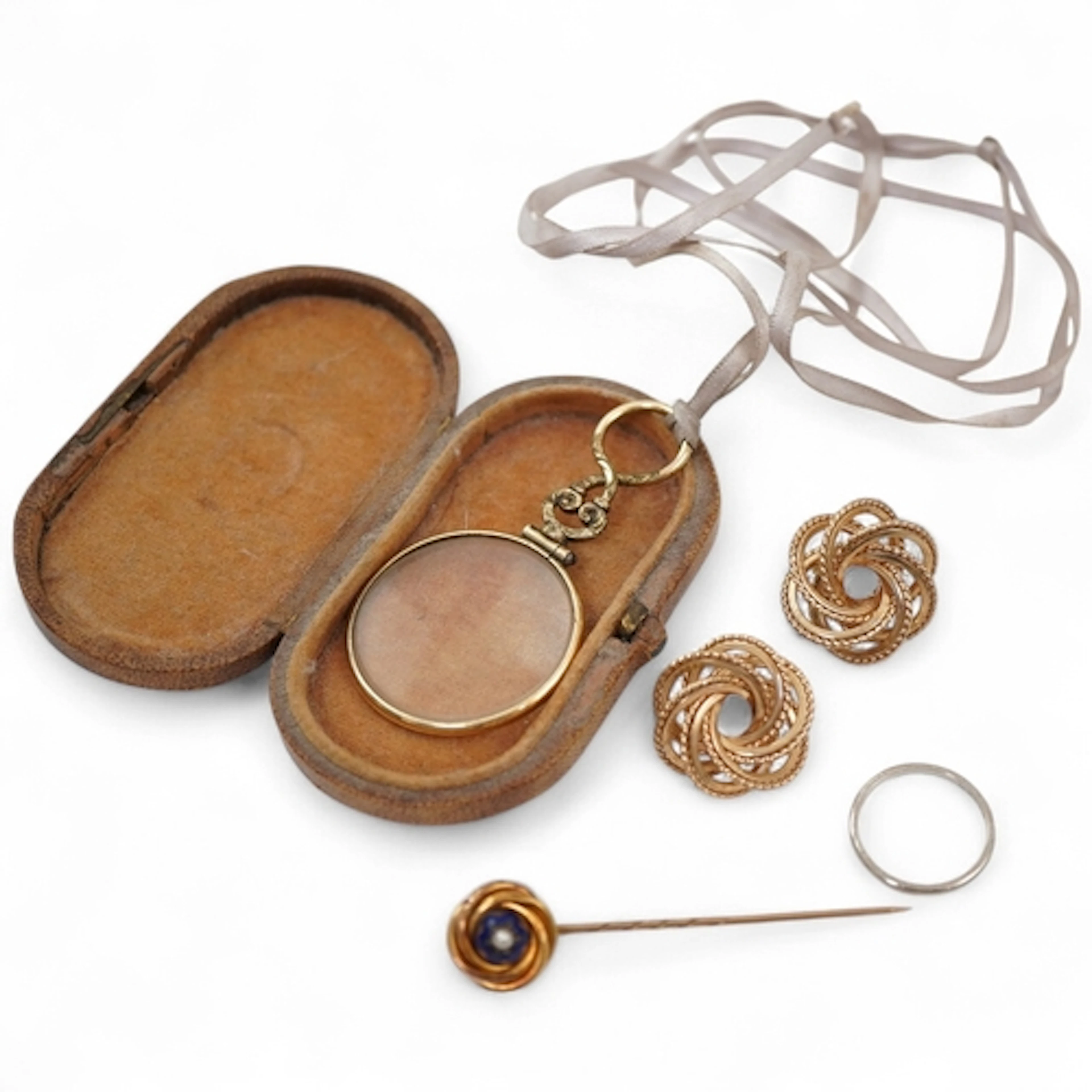 A collection of jewels, including a pair of earrings of knot...