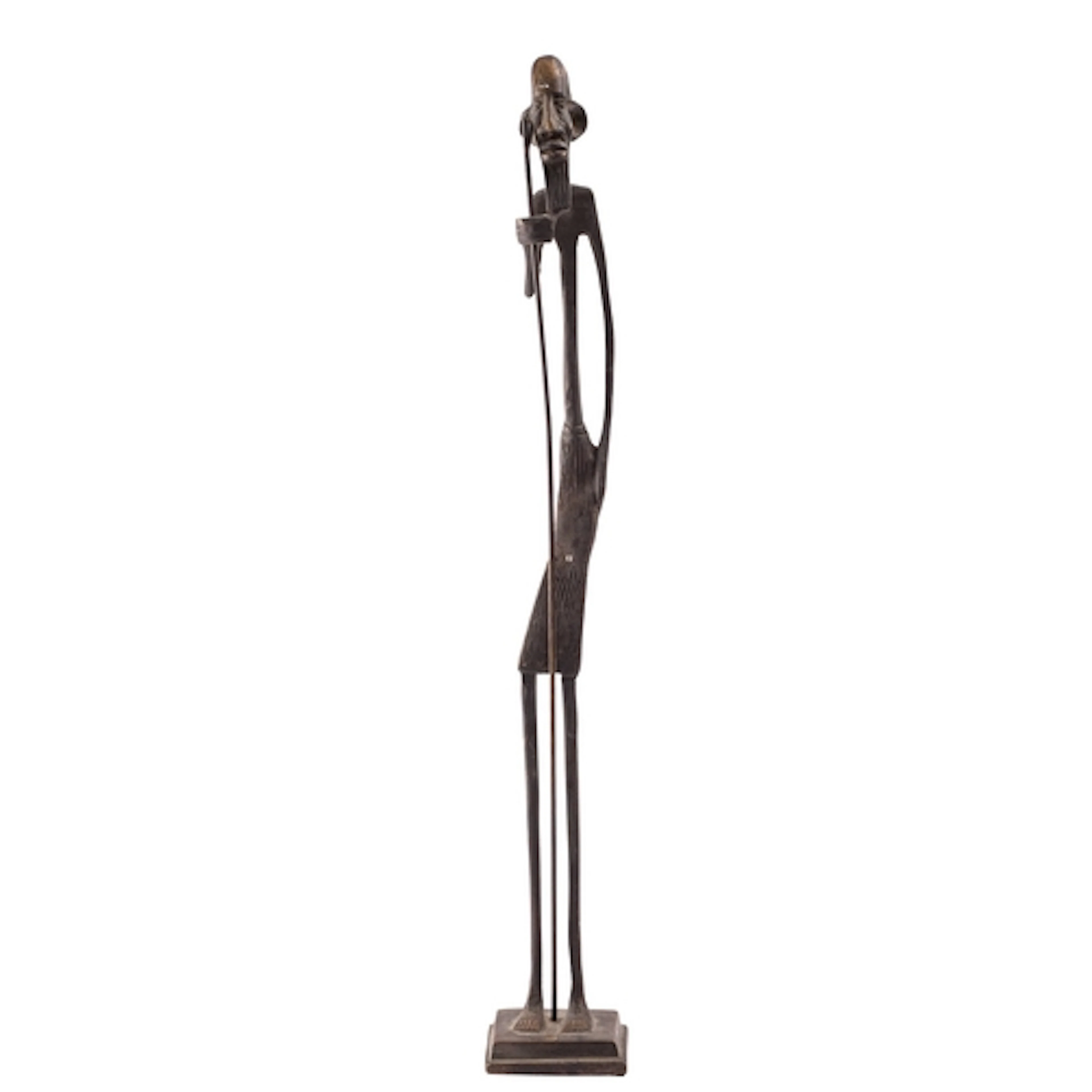 A West African patinated bronze model of an elder, loosely i...