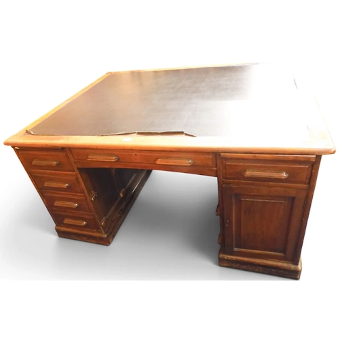 A large early 20th century oak partners desk with black skiv...