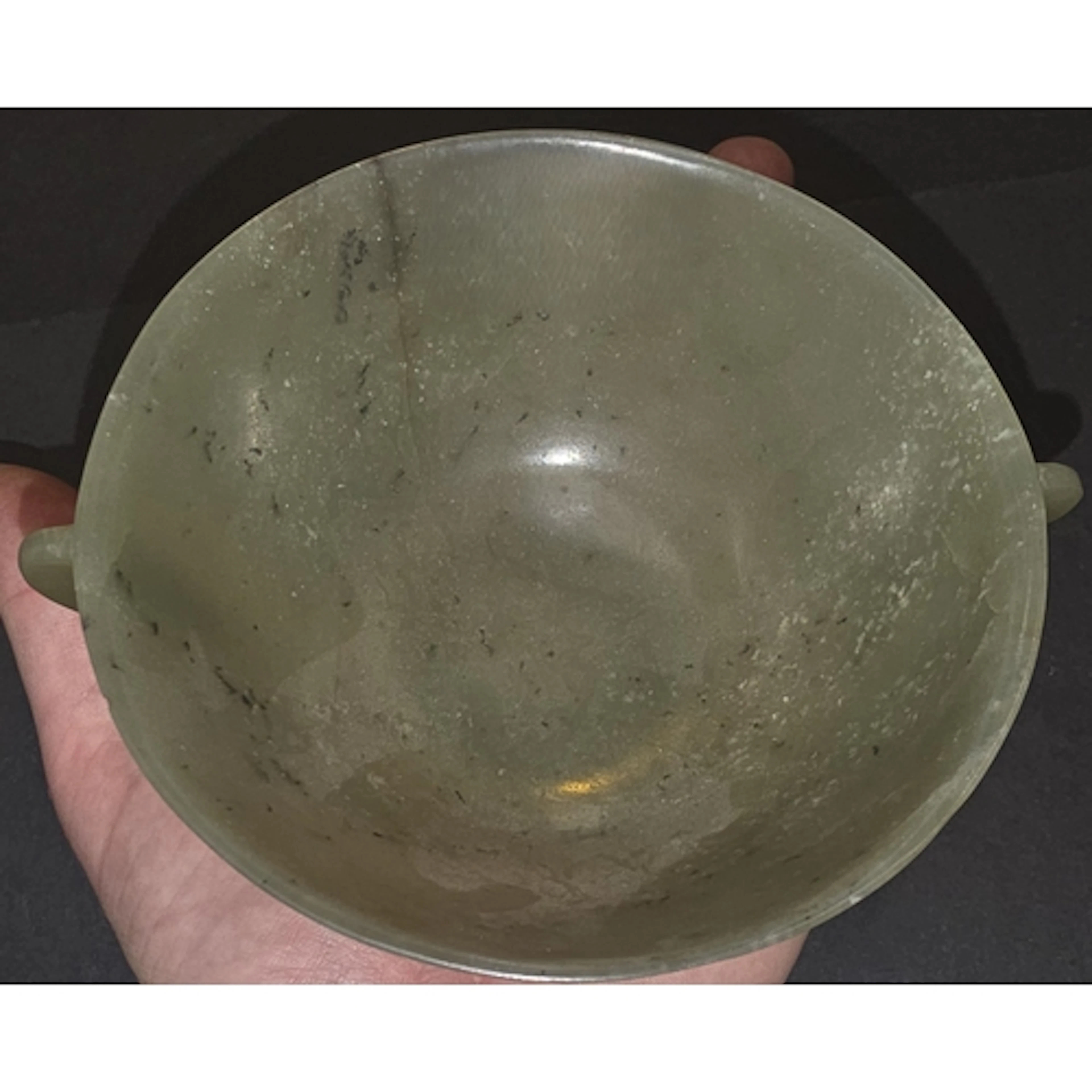 A Chinese pale green mutton fat jade wine cup/ bowl with ear...