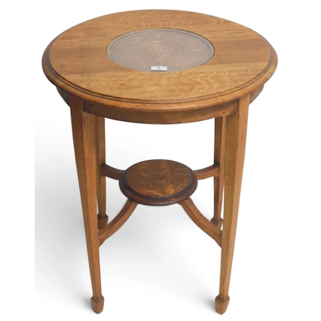 A 20th century oak two tier occasional table with circular t...
