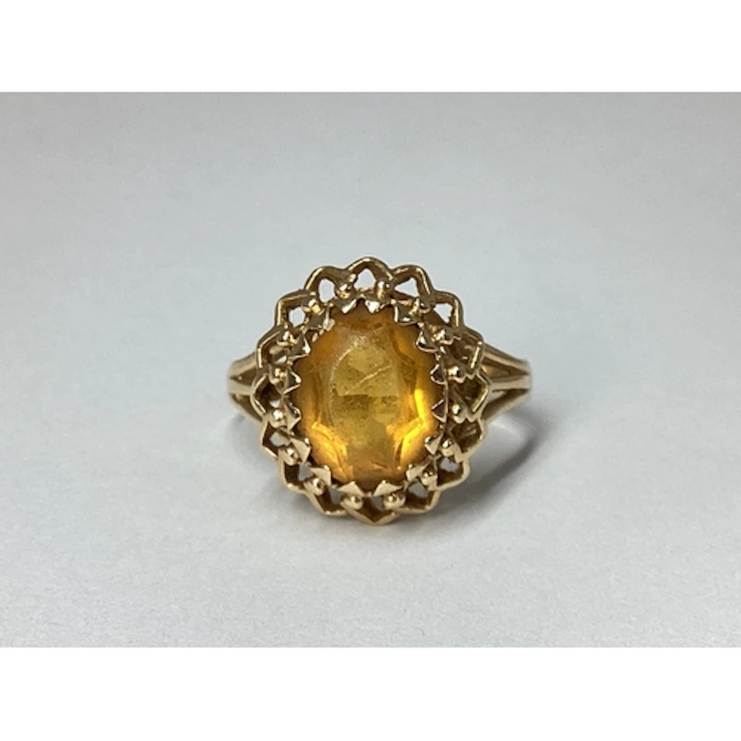 An Oval Single Stone Dress Ring, claw set within decorative ...