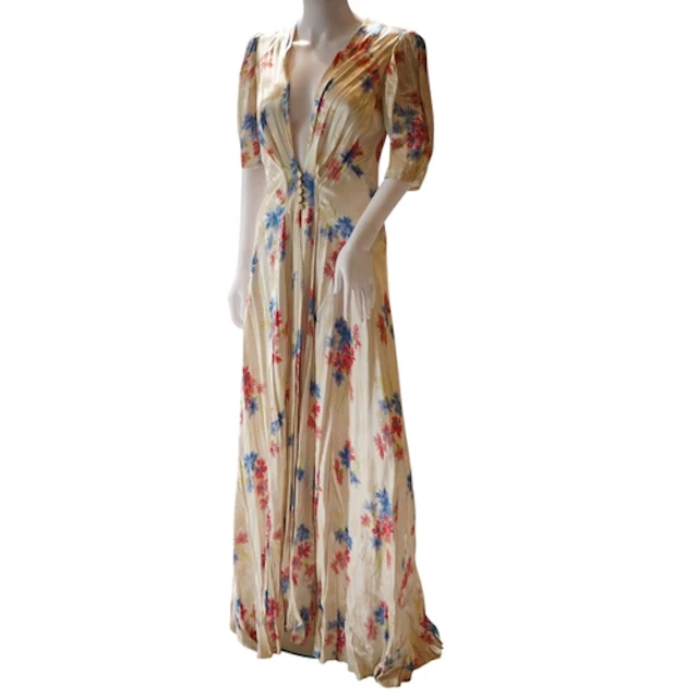A late 1930's early 40's cream silk satin floral full length...