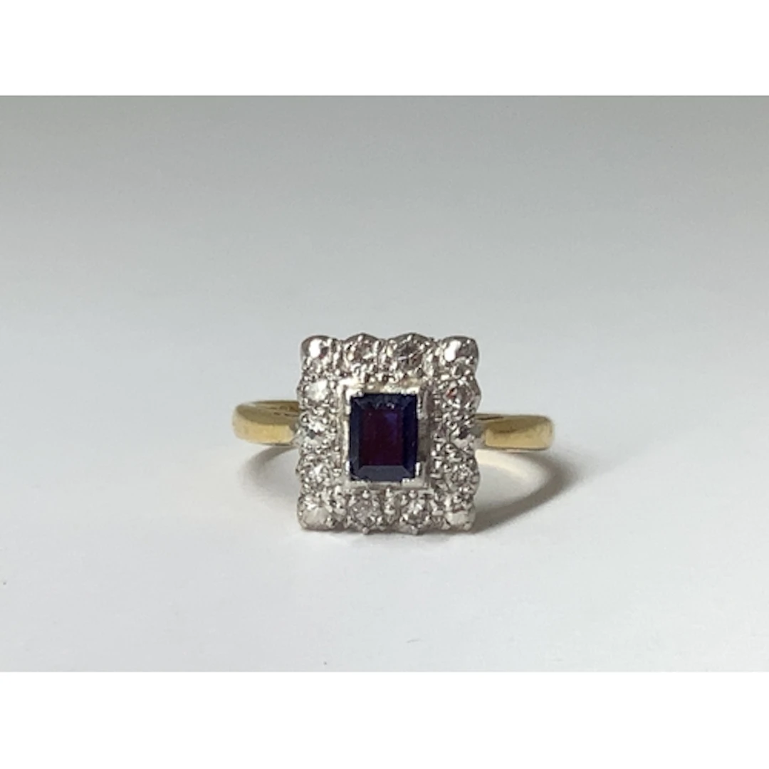 A Vintage Rectangular Cluster Ring, corner claw set to the c...