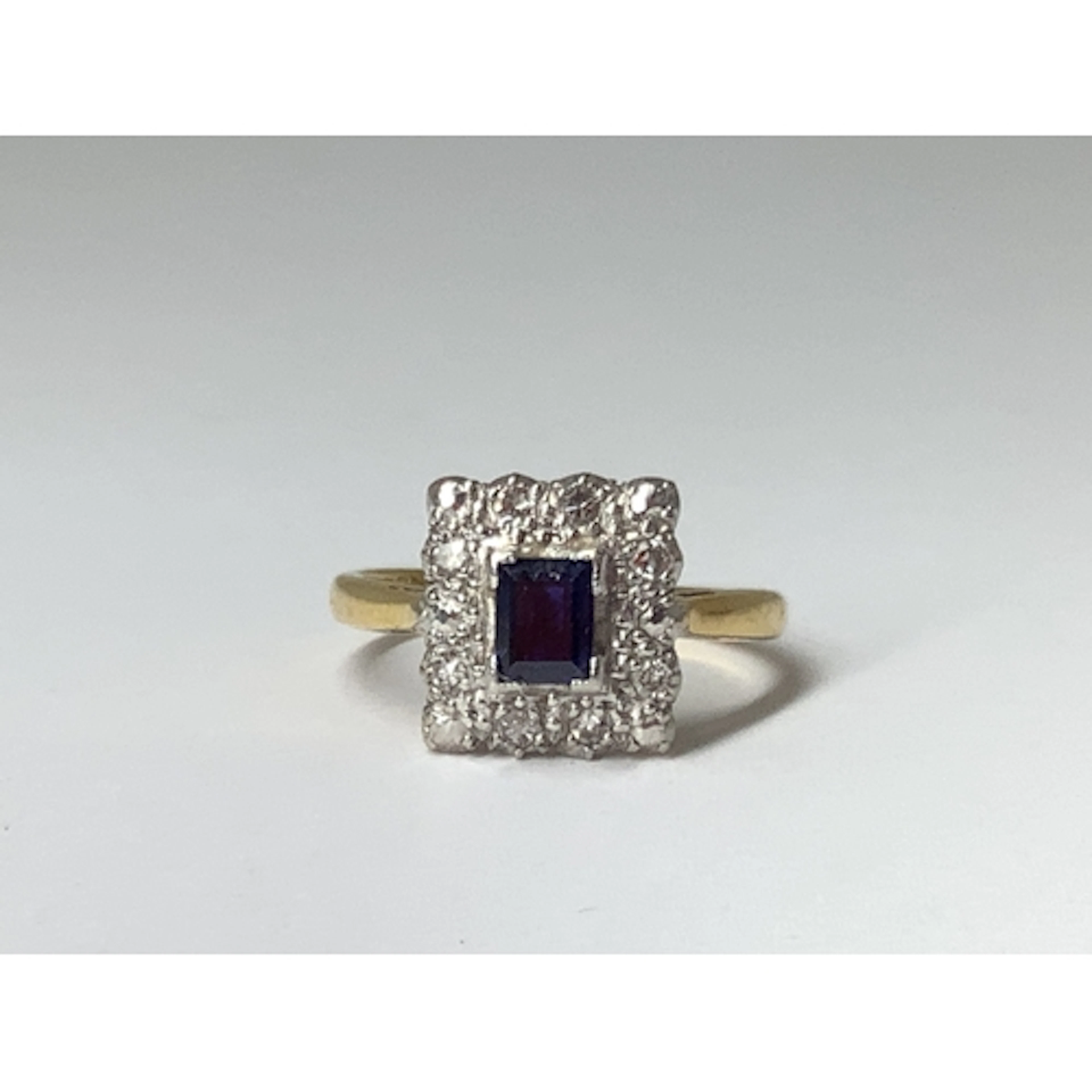 A Vintage Rectangular Cluster Ring, corner claw set to the c...