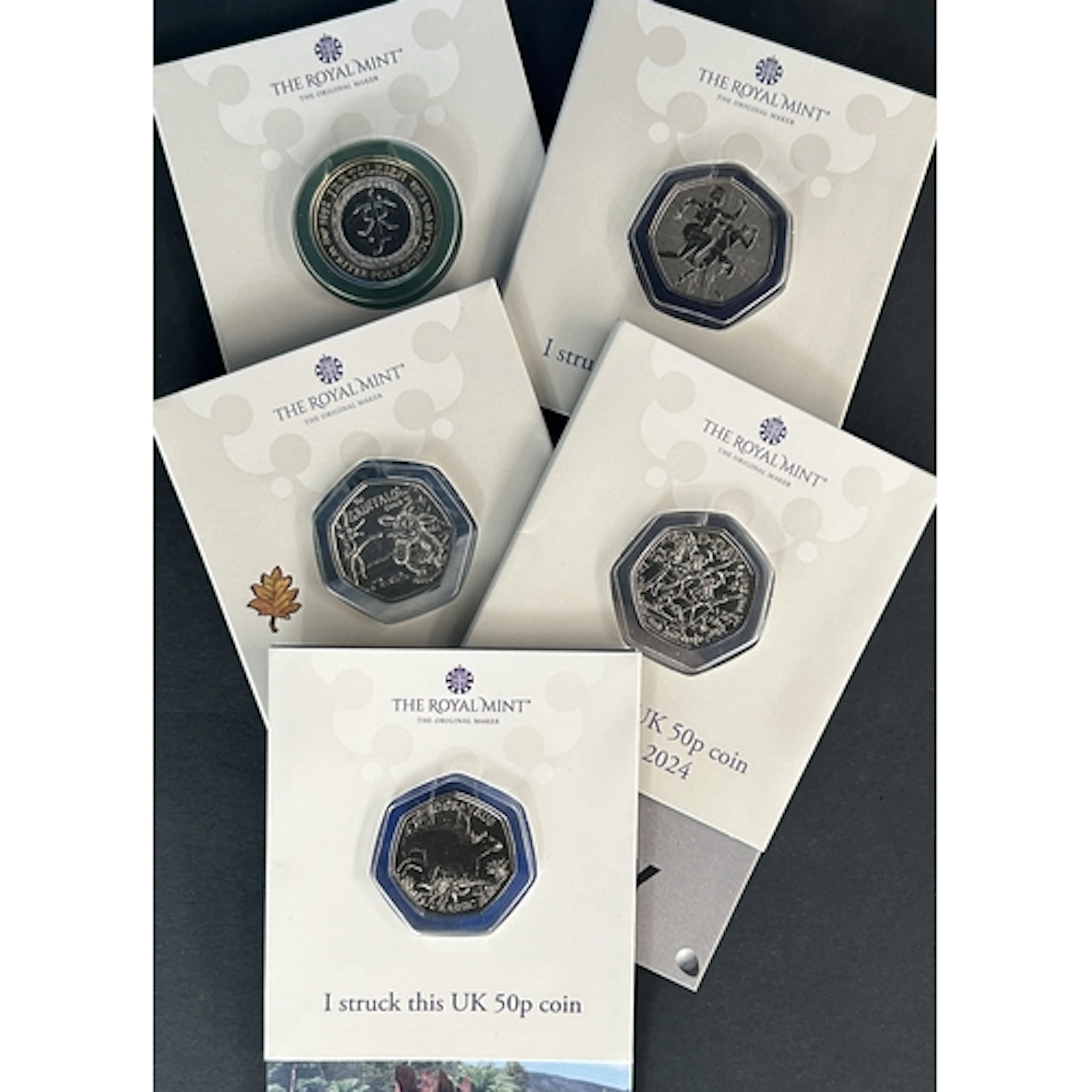 A group of five Great Britain Royal Mint Strike Your Own coi...