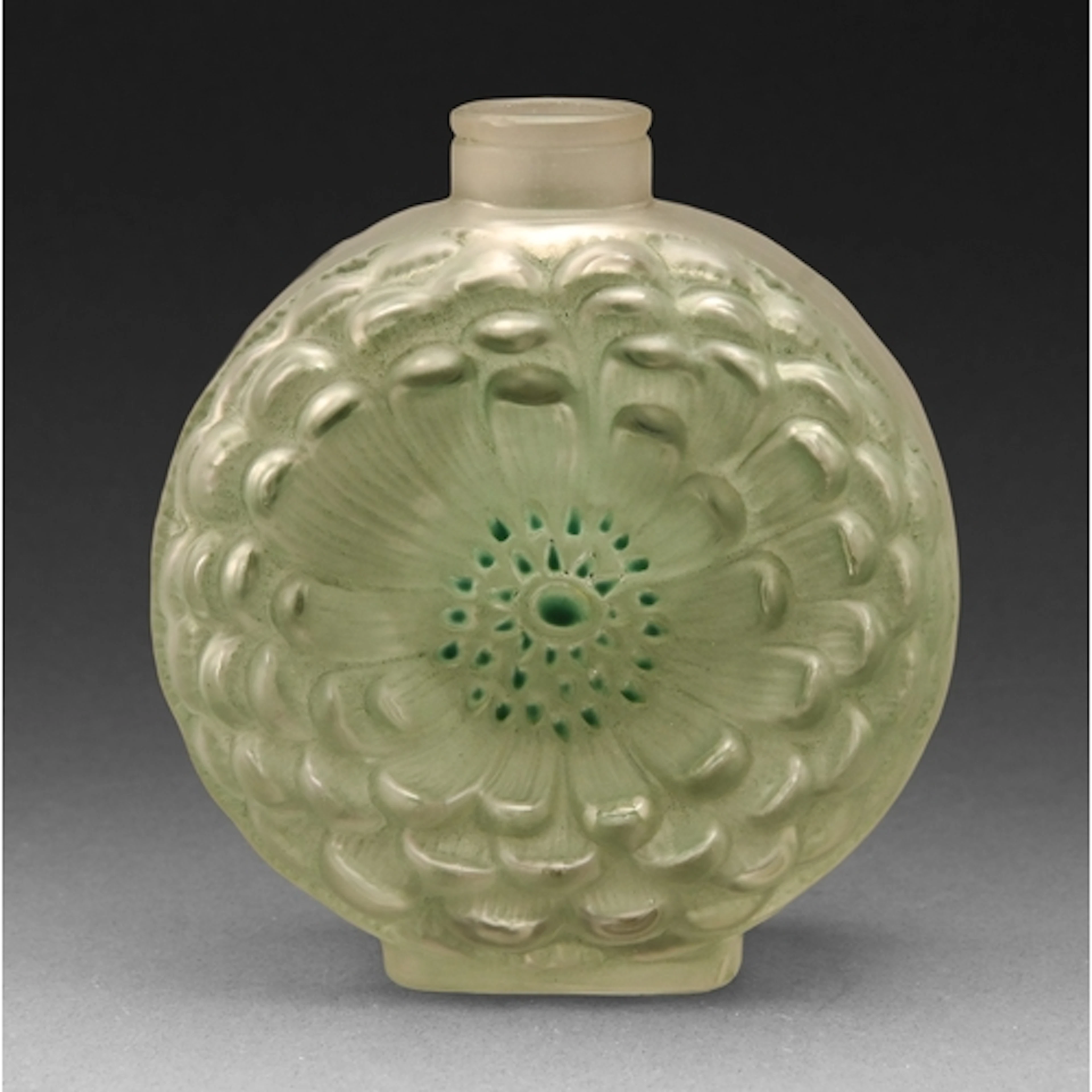 "Dahlia". A Lalique stained green glass scent bottle, c1930,...