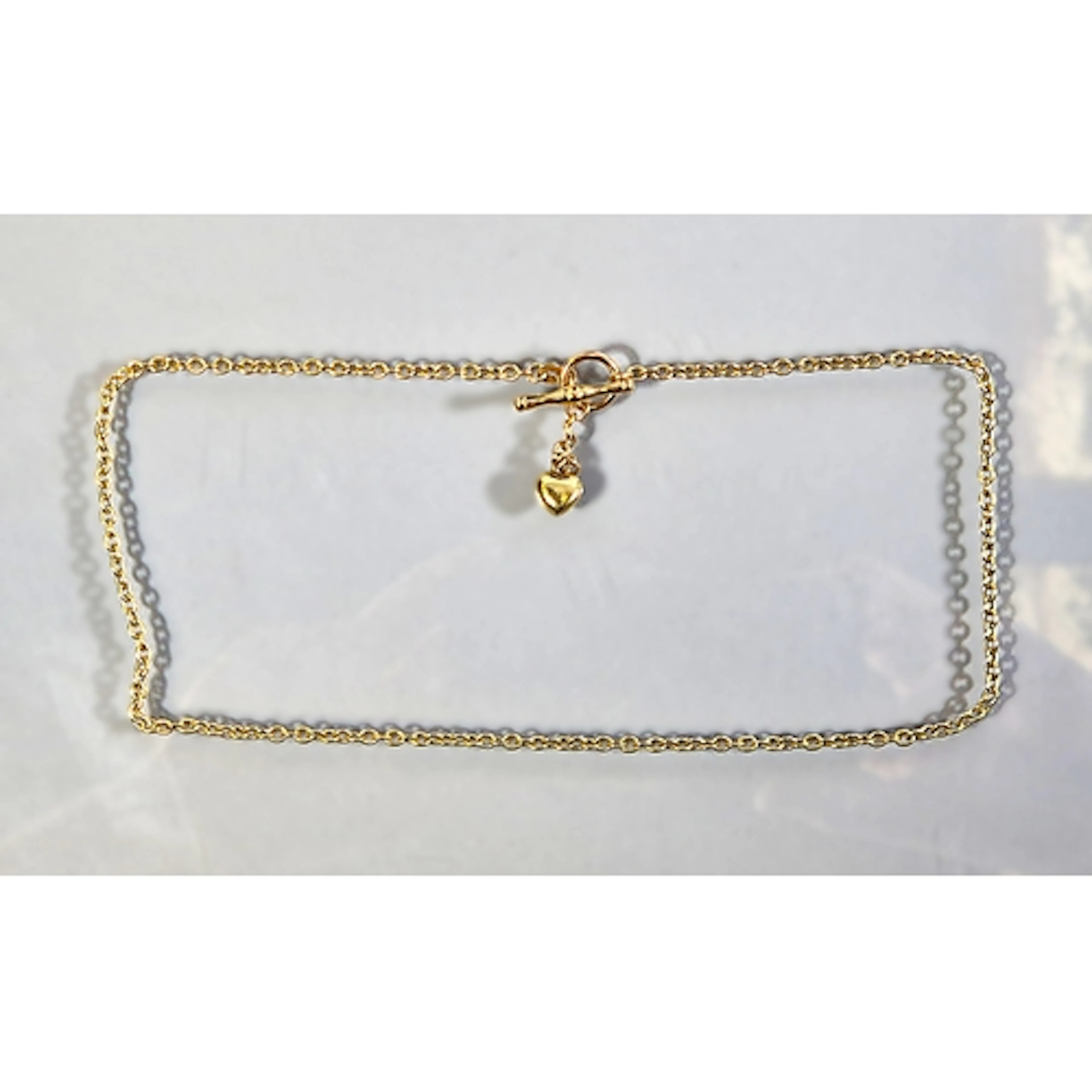 Italian 9kt gold curb link necklace with T-bar and heart dro...