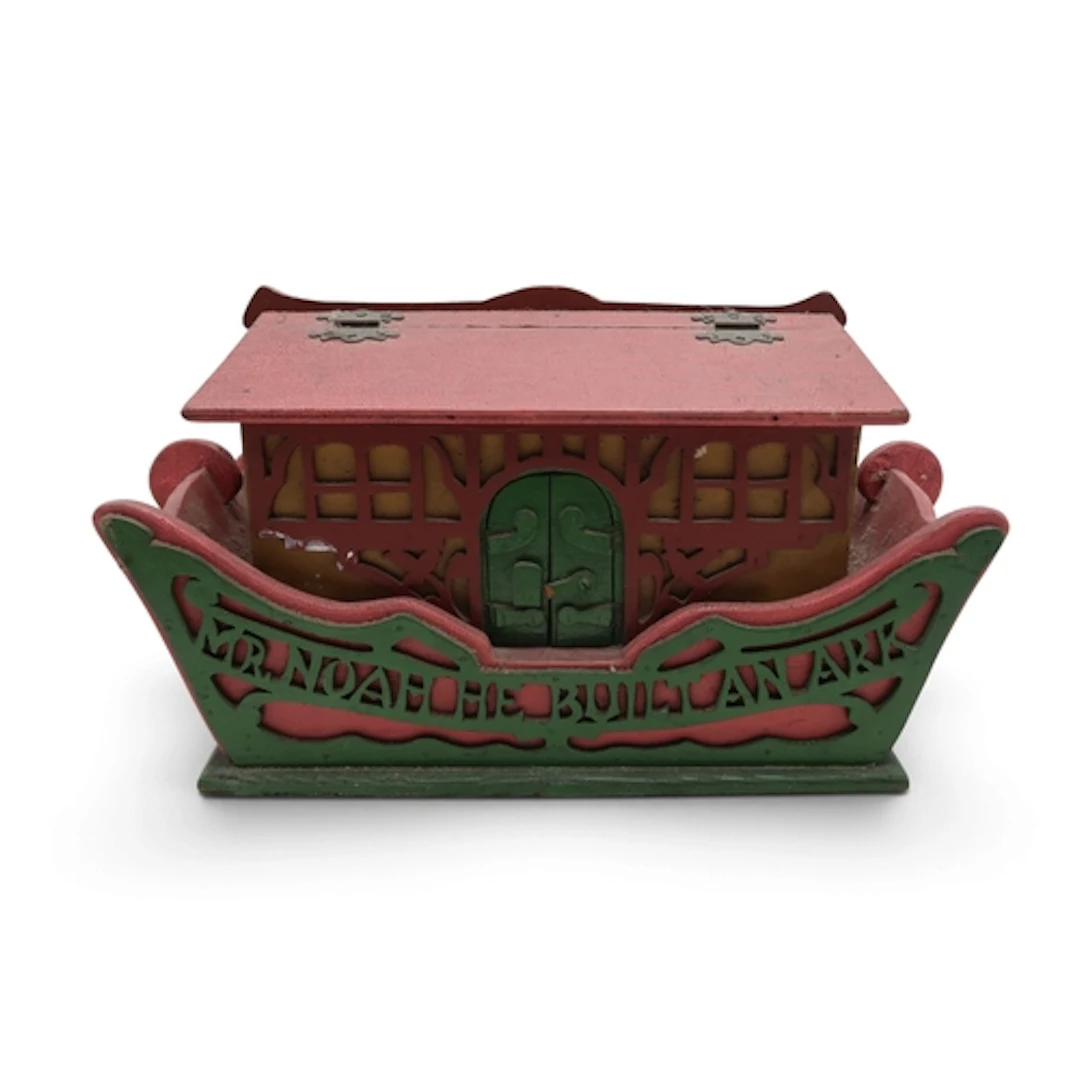 A wooden Noah's Ark, polychrome painted, with fret-cut panel...