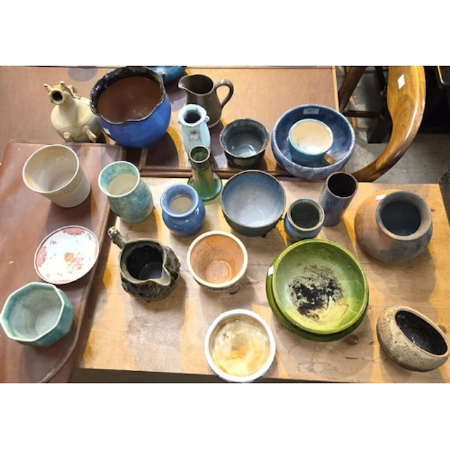 A collection of mid century studio pottery; a green glass lu...