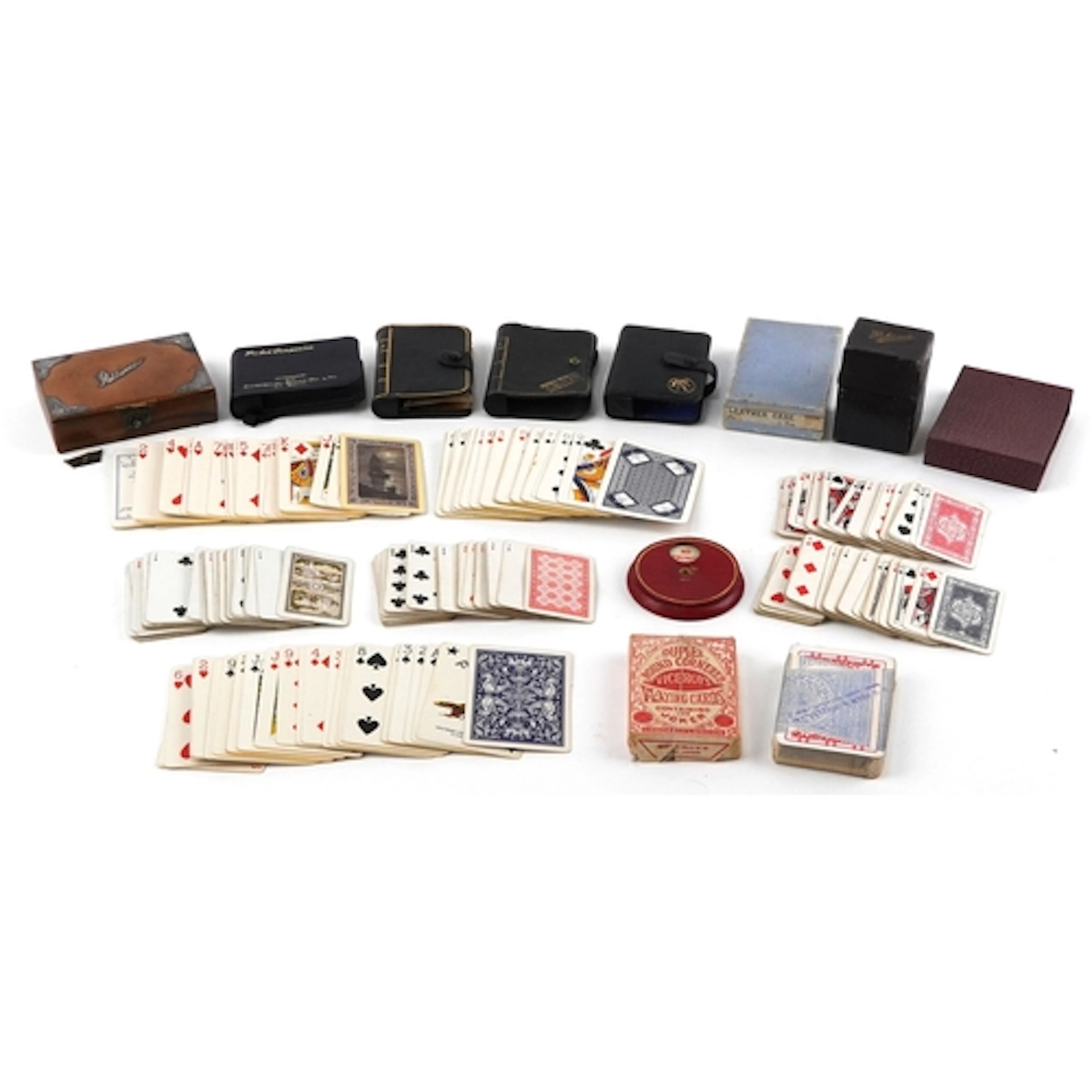 Collection of vintage playing cards with cases including a t...