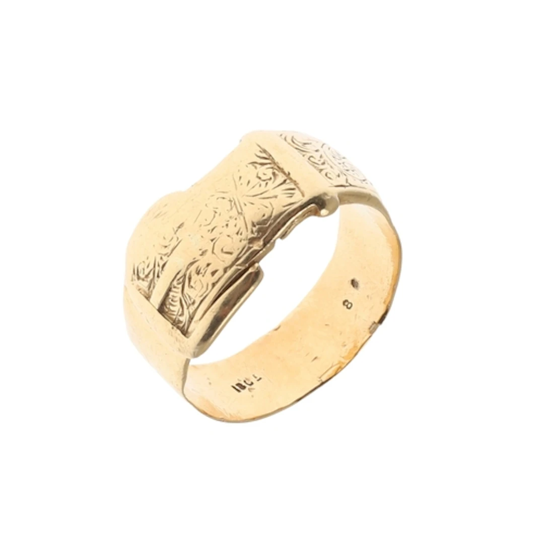 AN 18CT GOLD BUCKLE RING. with engraved foliate decoration t...