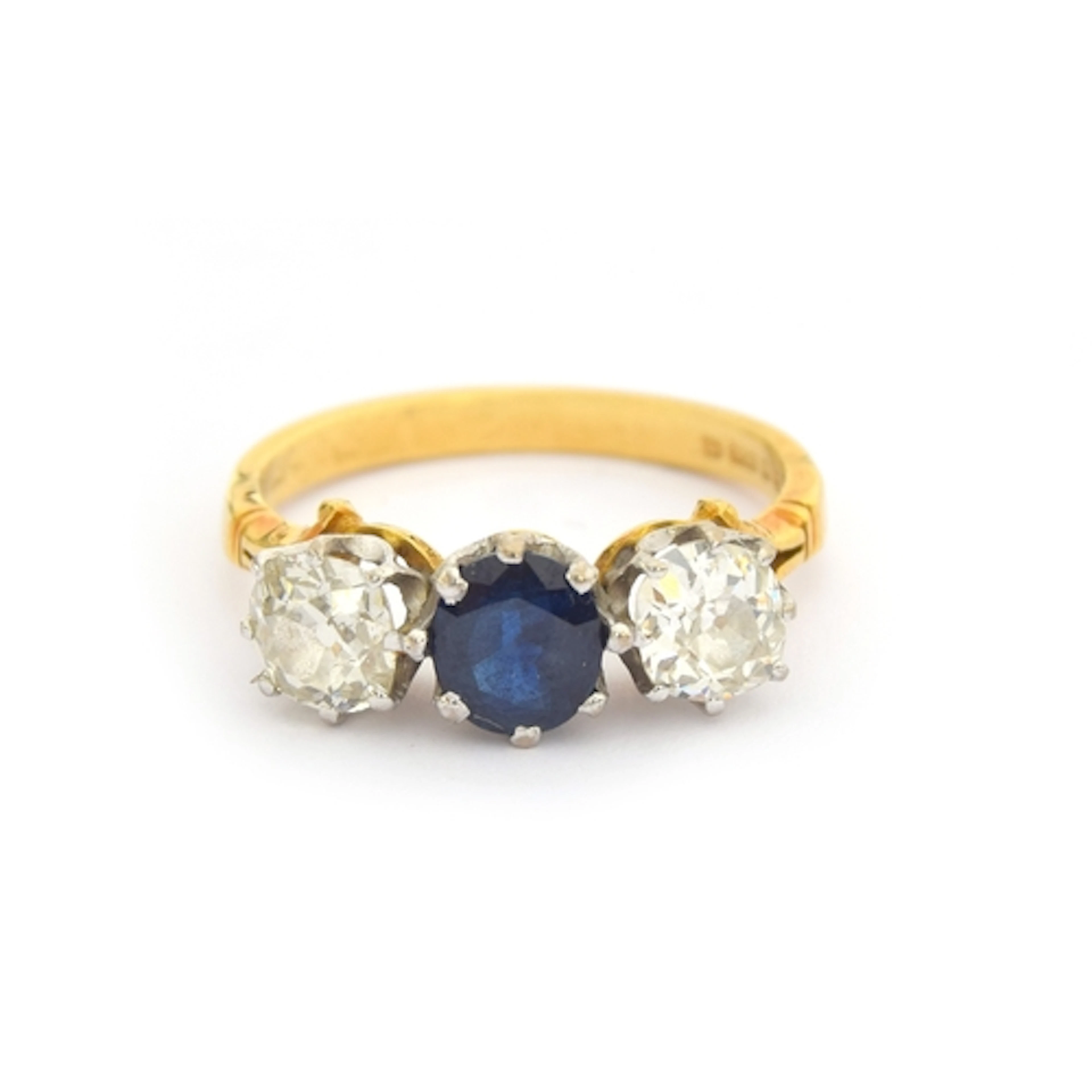 An 18ct gold diamond and sapphire trilogy ring, the old cut ...