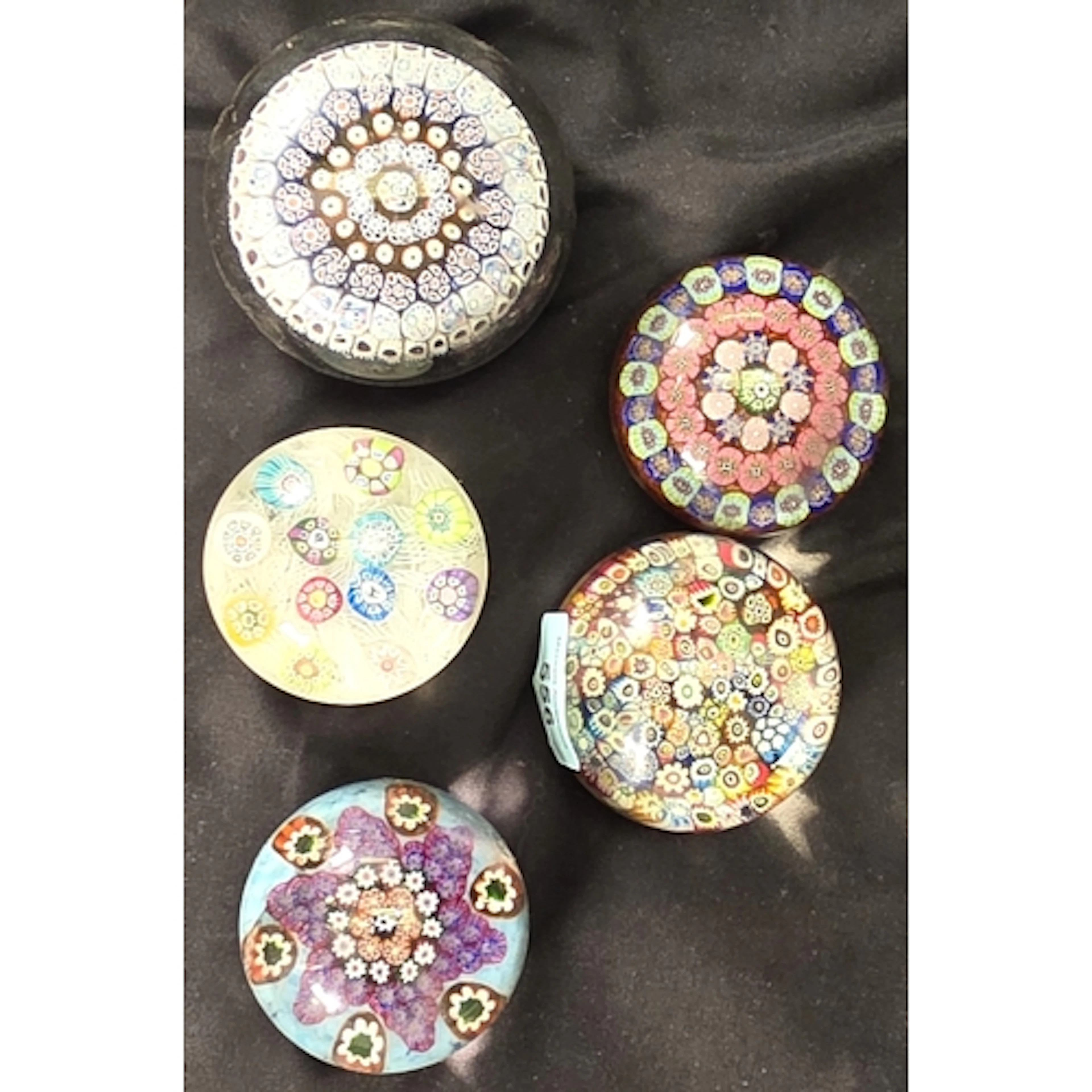 A close-pack Baccarat style Millefiori paperweight, and four...
