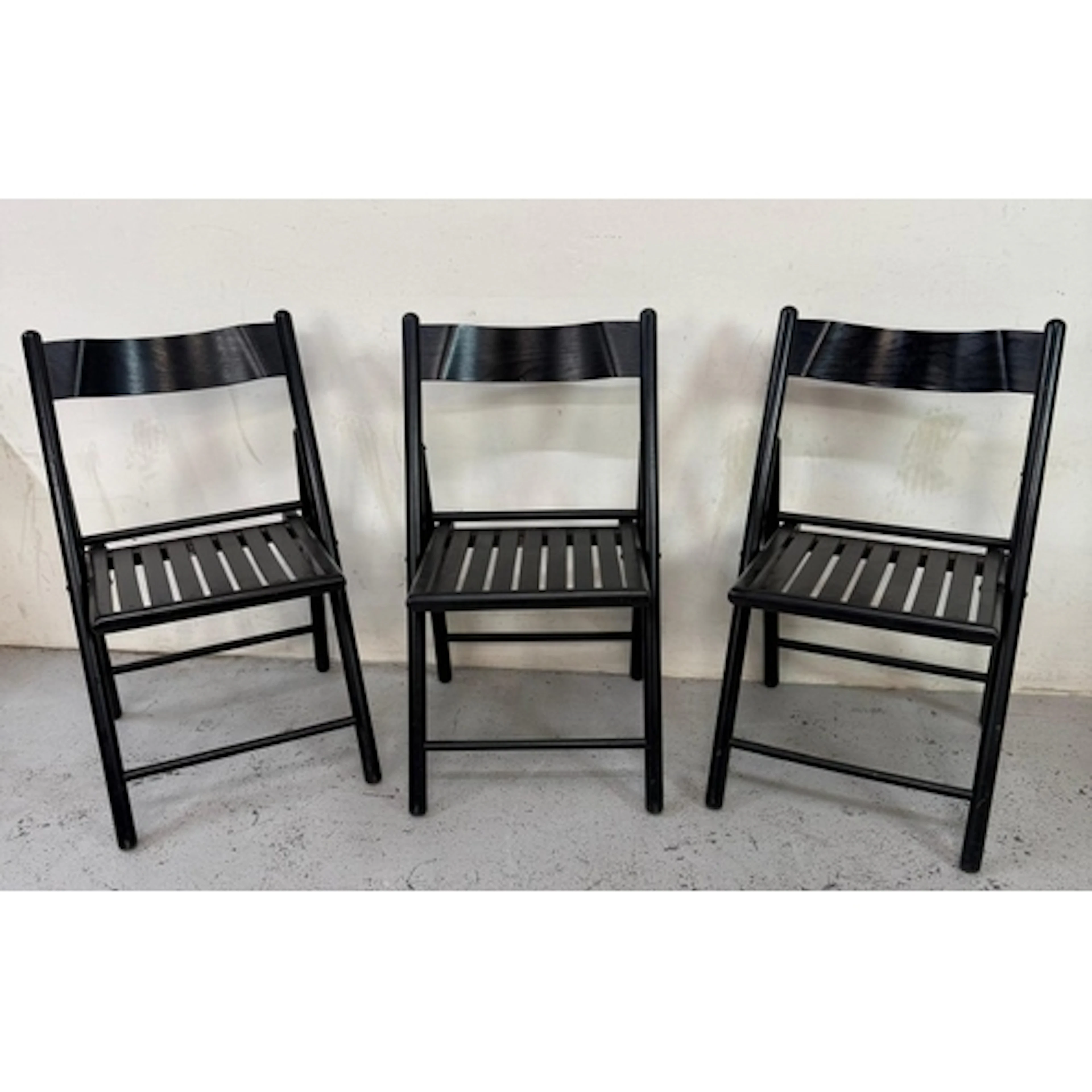 Three 1980's black folding chairs by Habitat. Code 725021....
