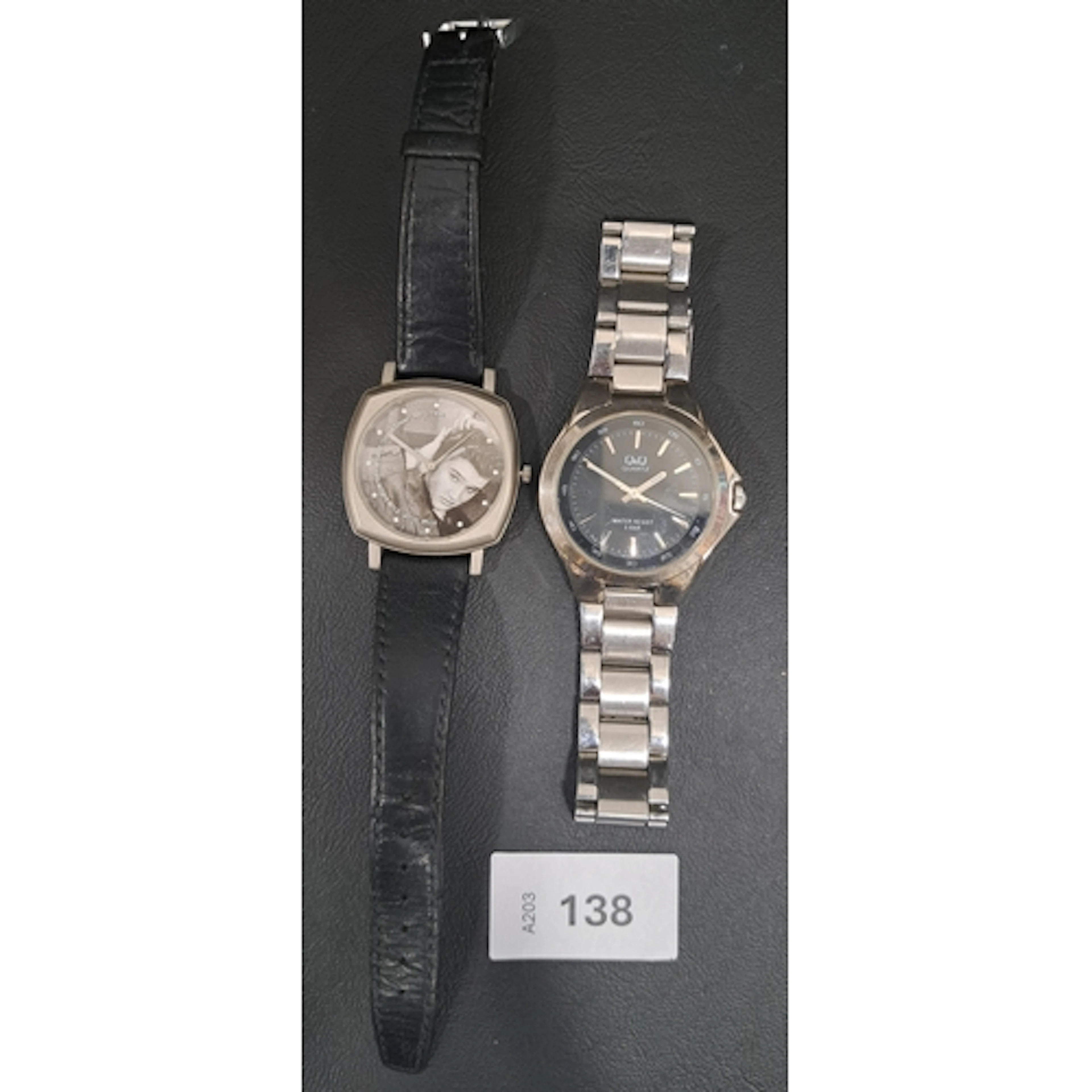 TWO FASHION WRISTWATCHES comprising a Q&Q analogue watch on ...