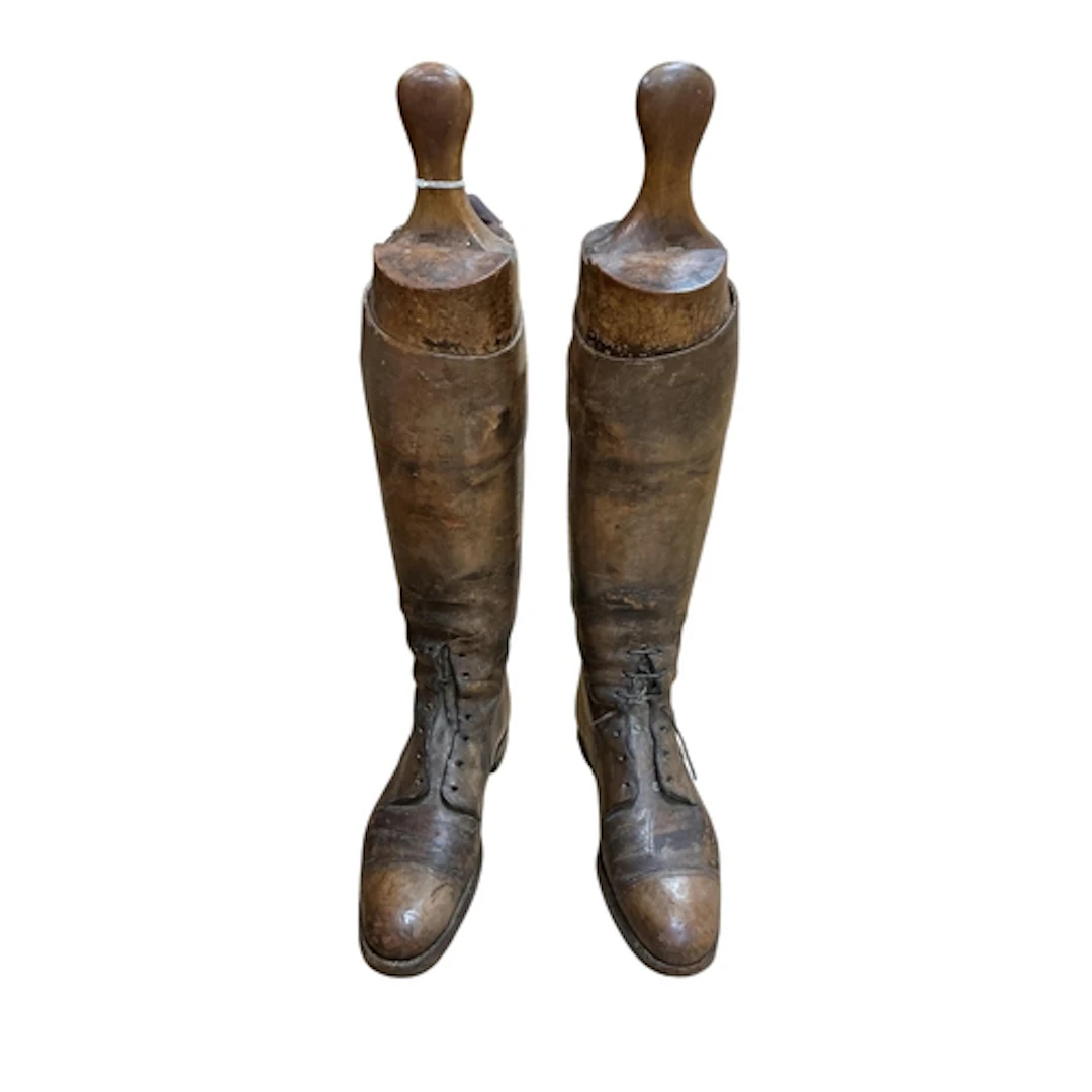 A pair of First World War brown leather boots with beech woo...
