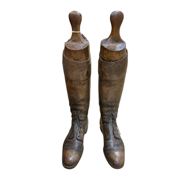 A pair of First World War brown leather boots with beech woo...