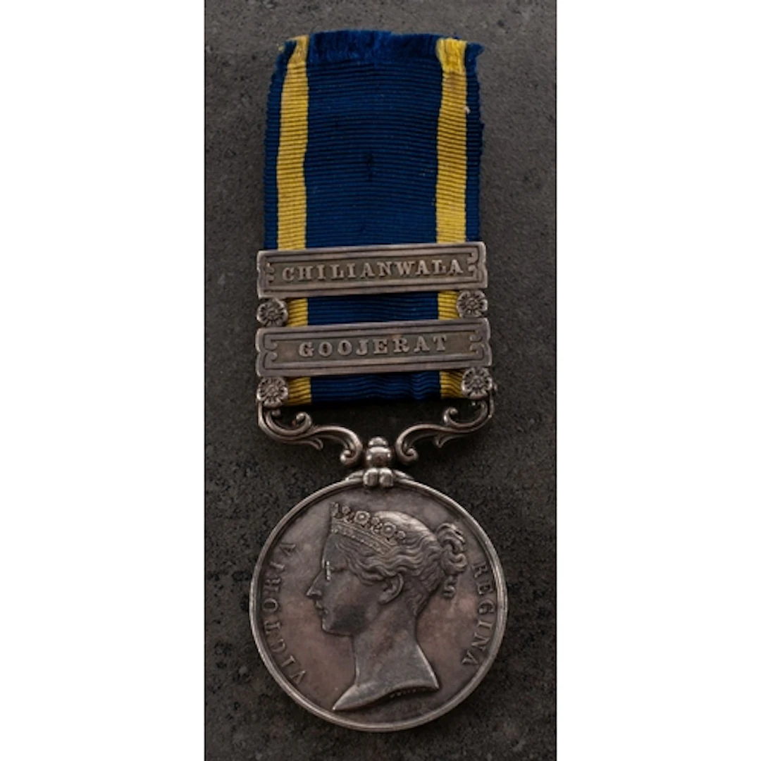 A Victorian Punjab Medal with two clasps to 'Rough Rider Joh...