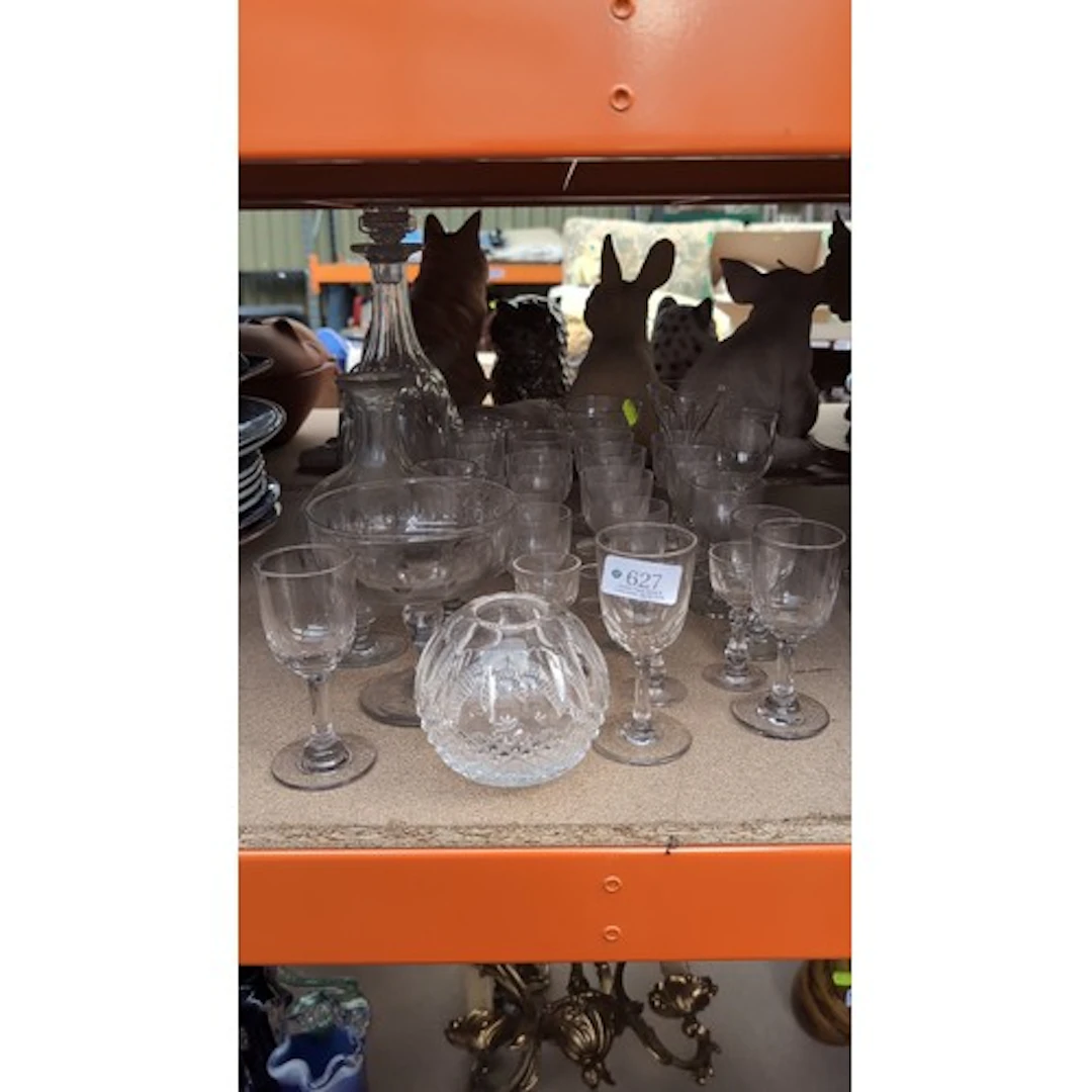 A group of clear glass tableware comprising stemmed drinking...