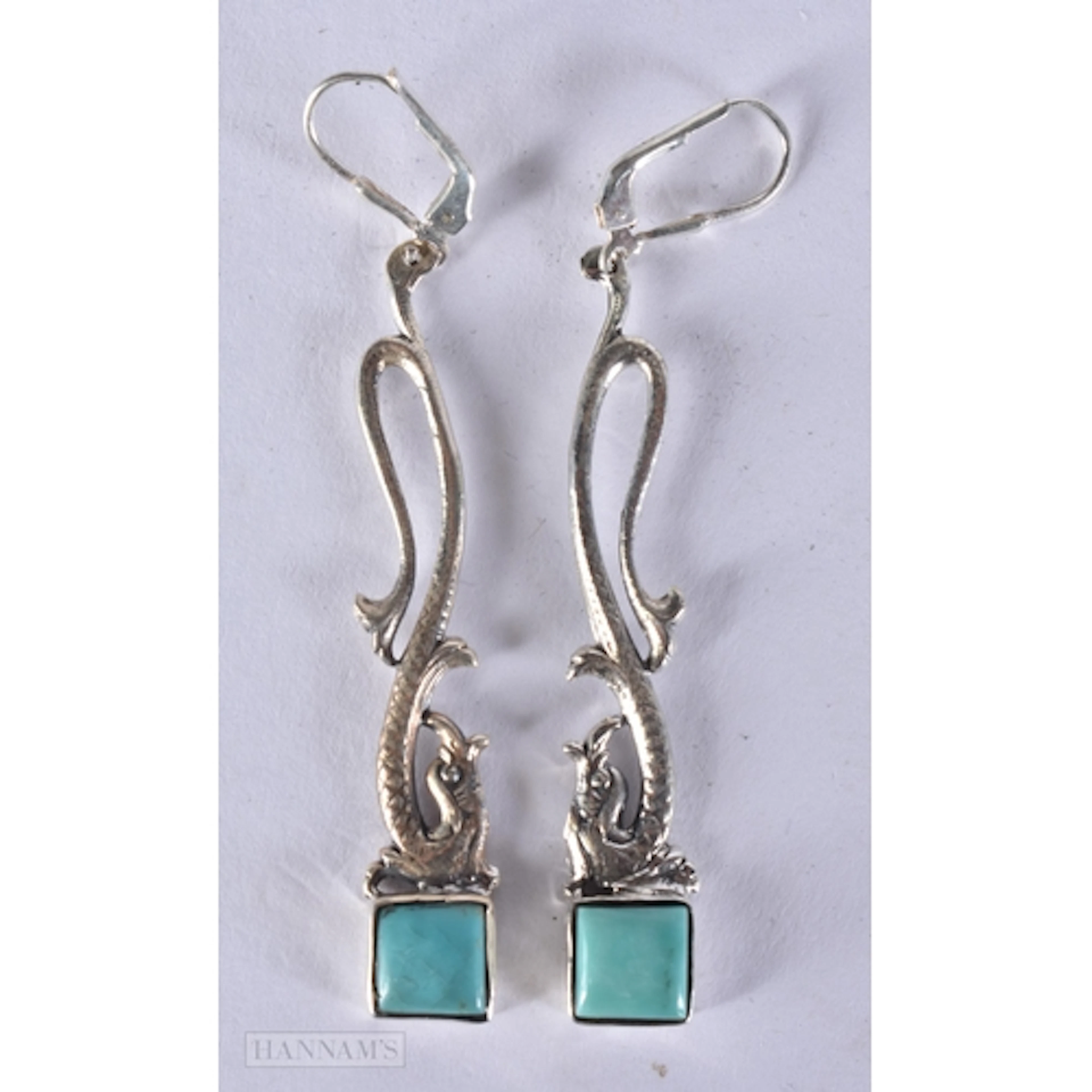 A PAIR OF SILVER AND TURQUOISE EARRINGS. 7.2 x 1.1 cm. 7.7 g...