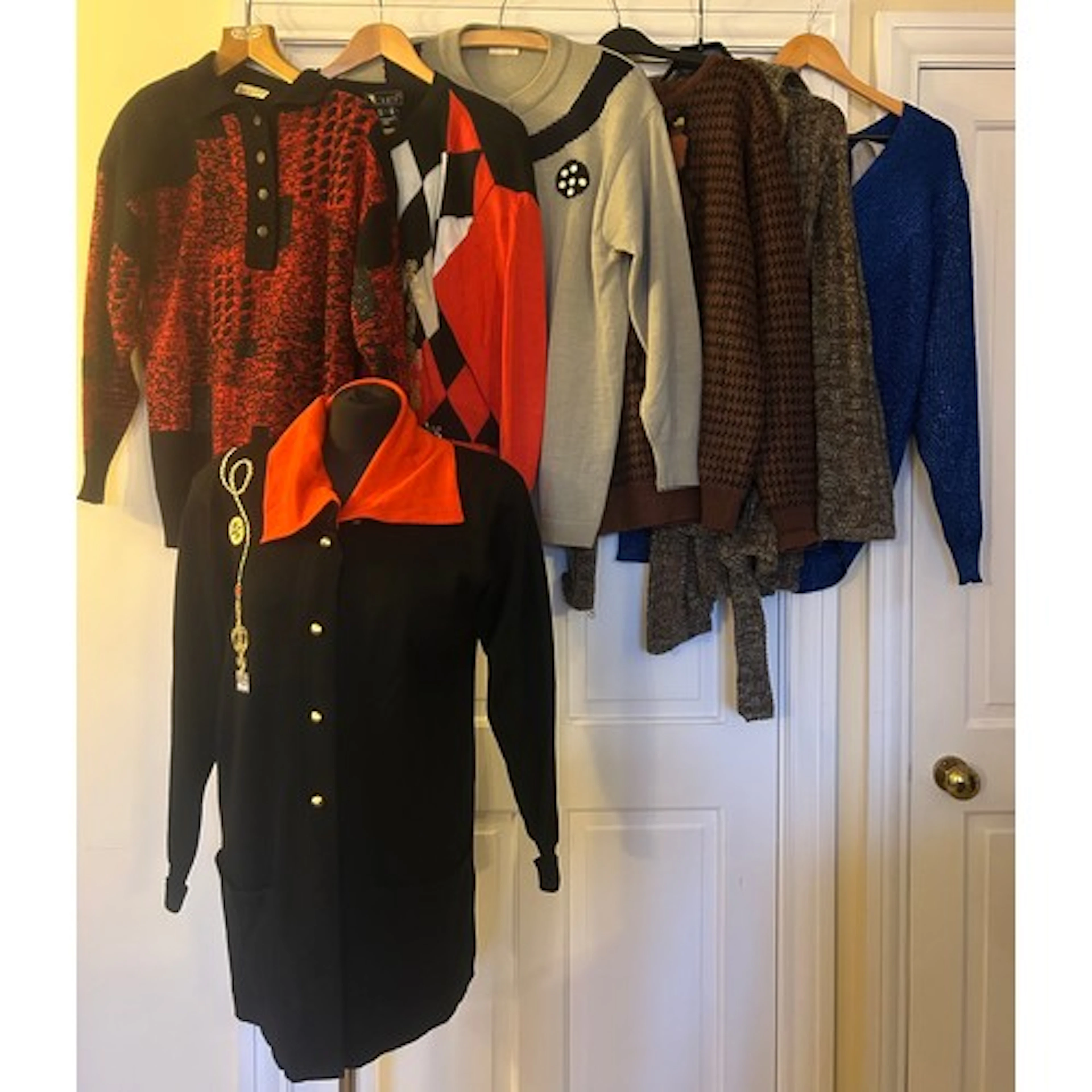 A selection of 1980’s and early 90’s knitwear: a black Laure...