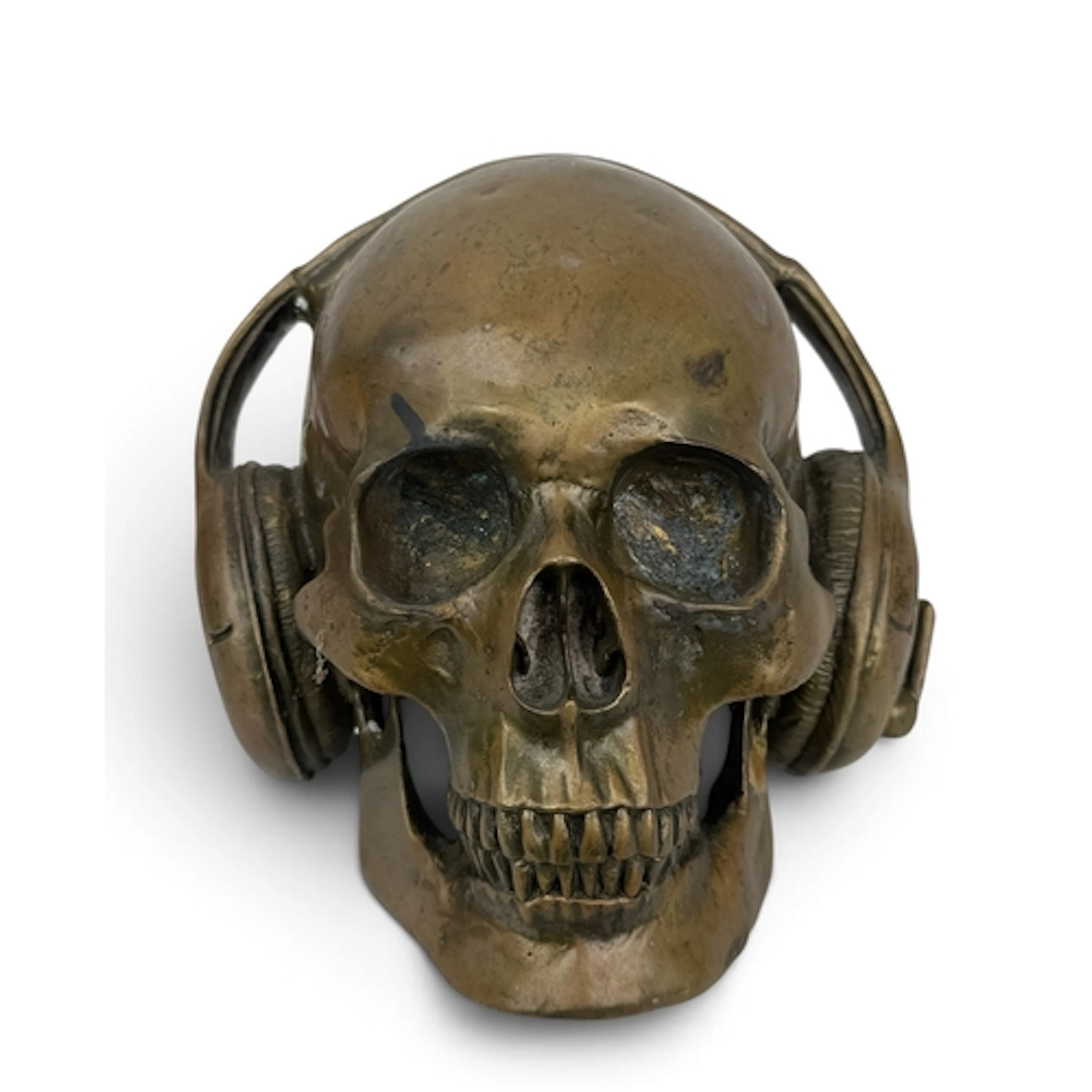 A BRONZE SKULL WEARING HEADPHONES