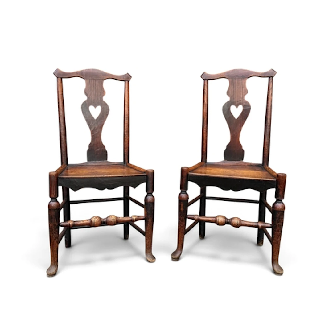 A PAIR OF 19TH CENTURY OAK HALL CHAIRS Each with central spl...
