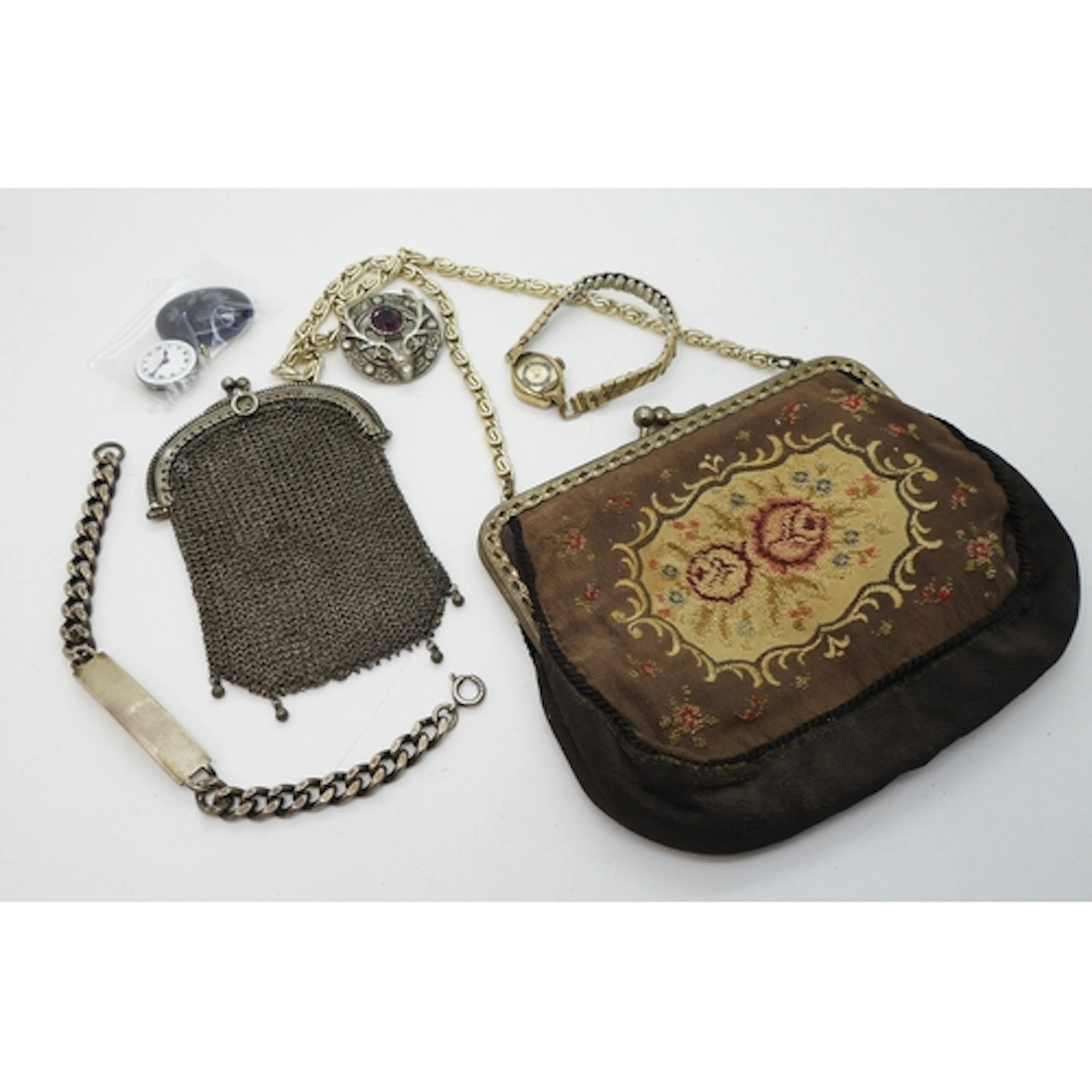 A Continental silver mesh purse, a silver identity bracelet,...