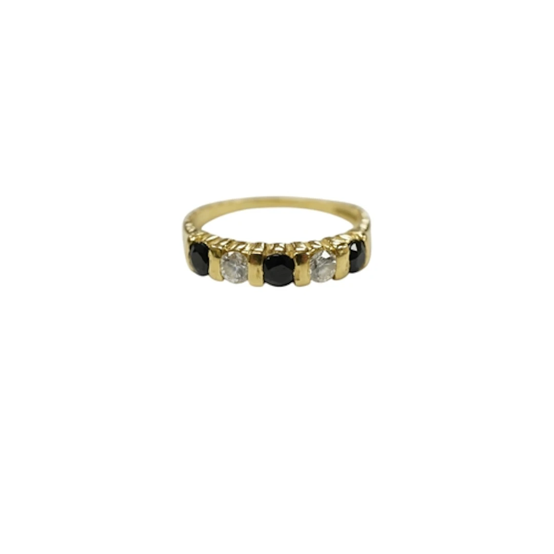 A modern 18ct gold, three stone sapphire and two stone diamo...