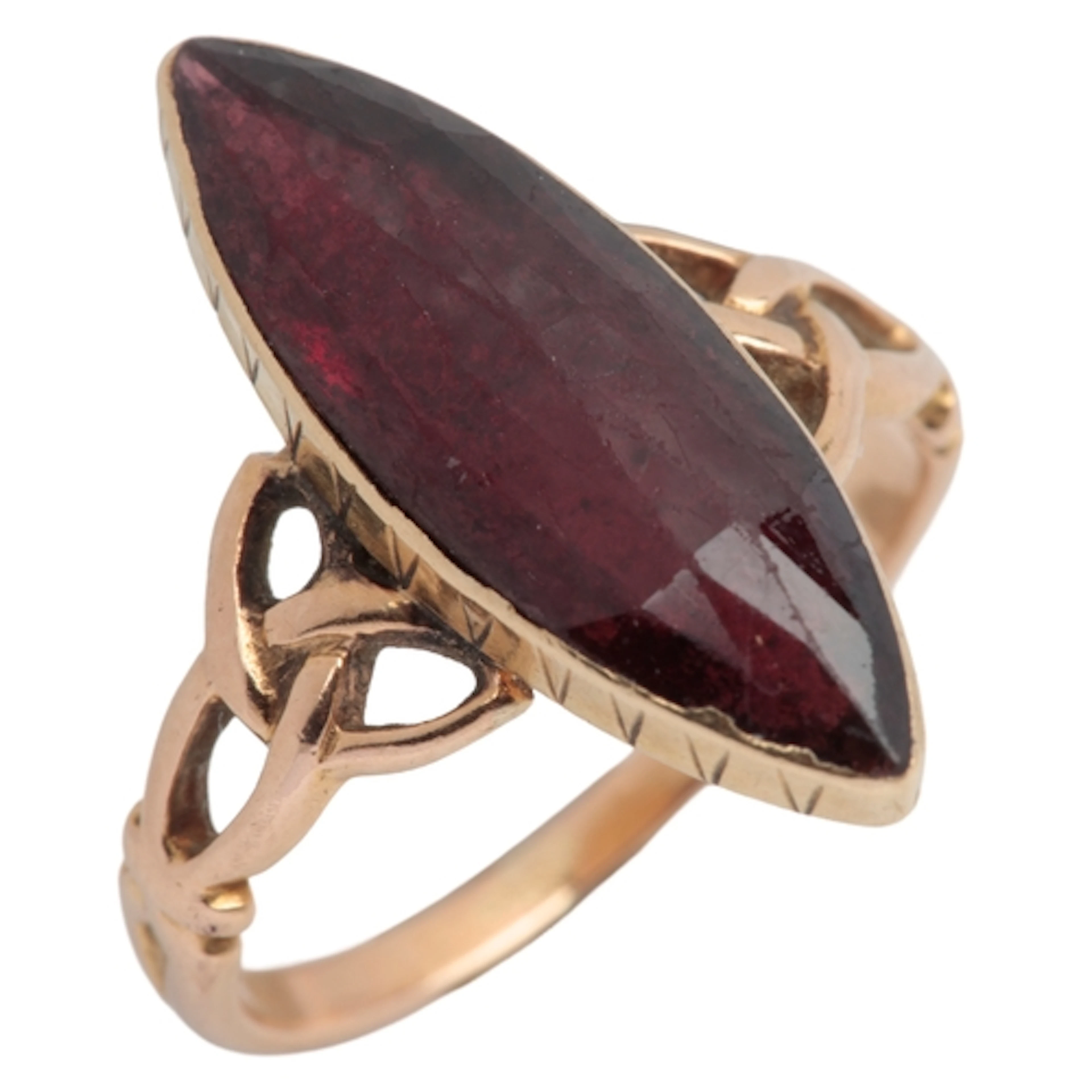 A garnet ring, circa 1900, set with an inverted marquise-sha...